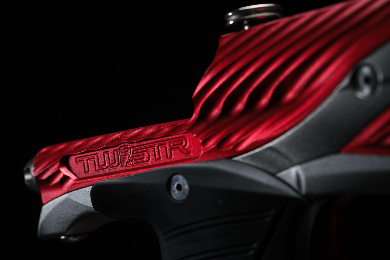Close-up detail of red motorcycle body panel with sleek aerodynamic design.