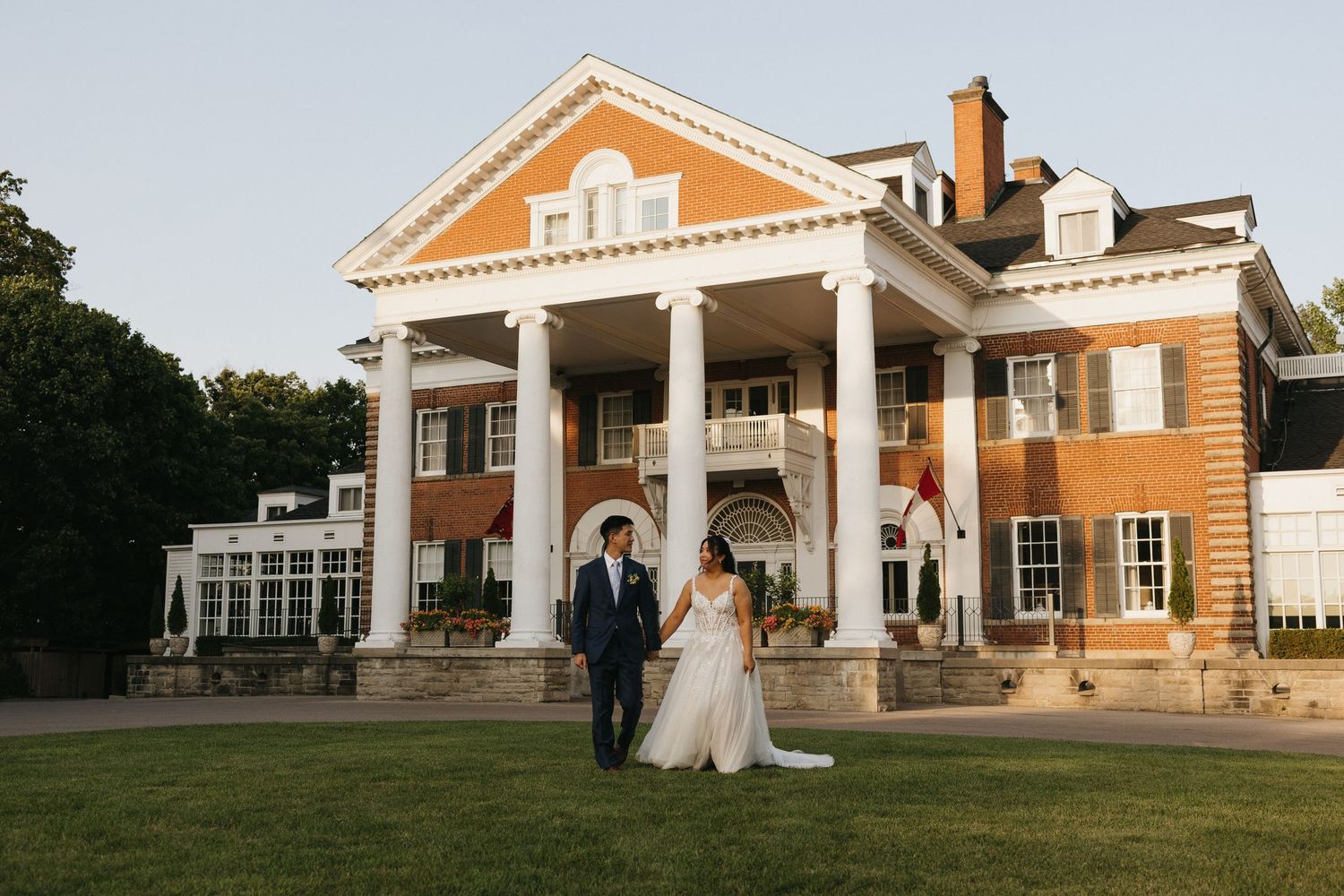 An intimate wedding moment shared in front of Langdon Hall in Cambridge ON