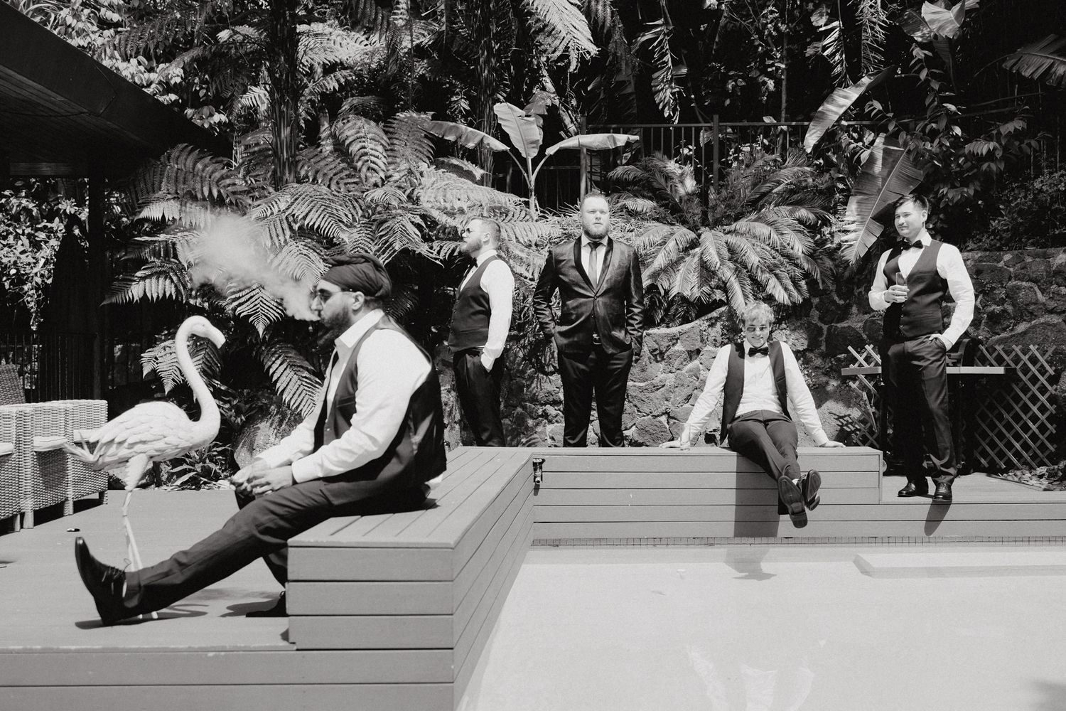 A vintage black and white photograph of the boys on a wooden stage or platform, captured by Apertured Media Auckland Wedding Photographer.