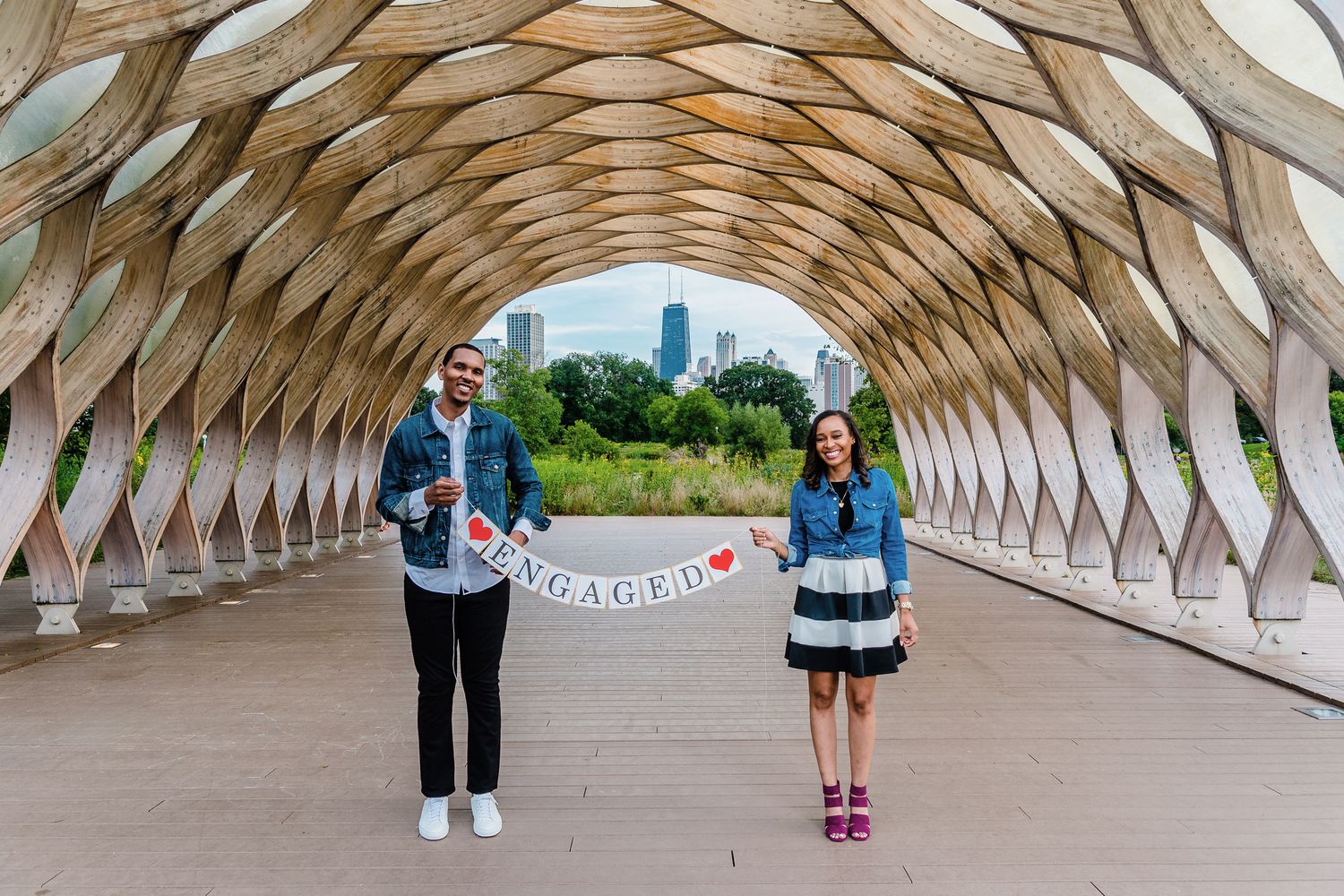 Engagement photo of couple at the honeycomb in South Pond at Lincoln Park.
