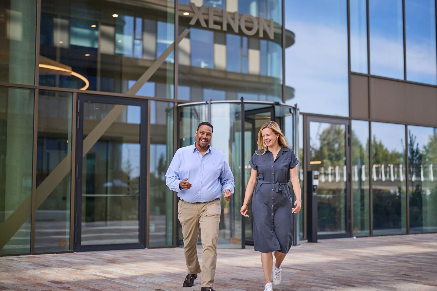 Corporate event photographer in Europe highlighting executive exchange during executive meeting.