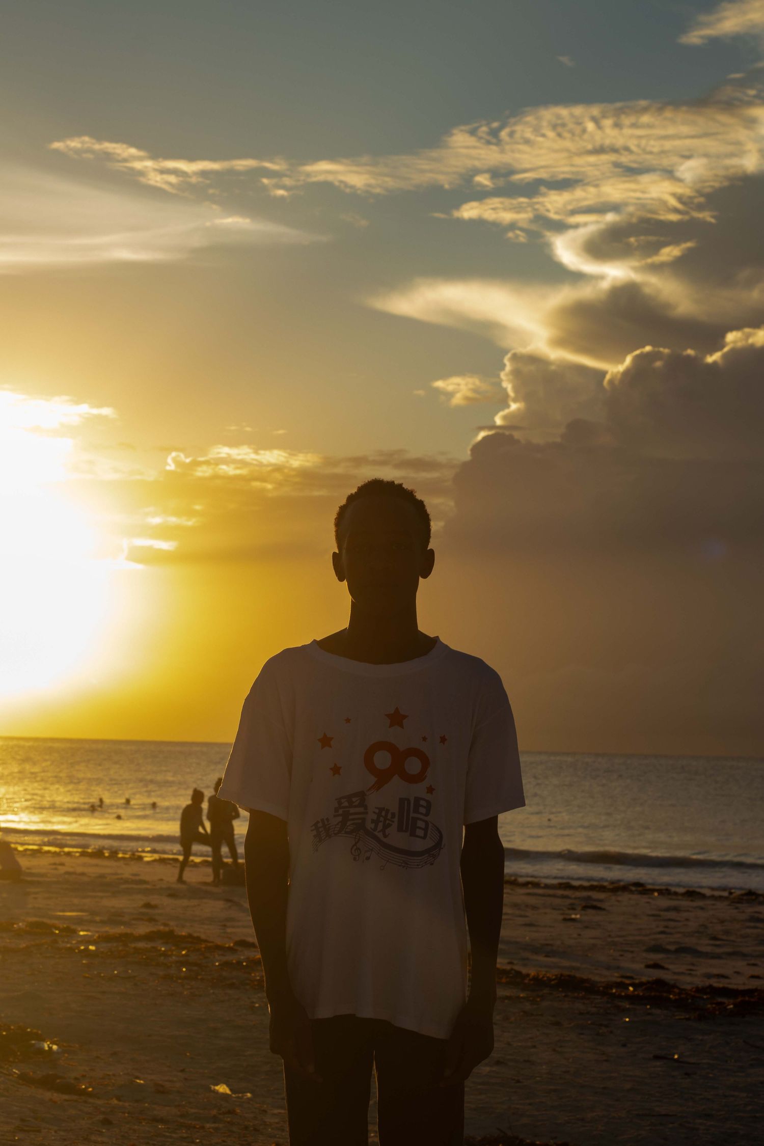 A silhouette of a human against bright morning sun