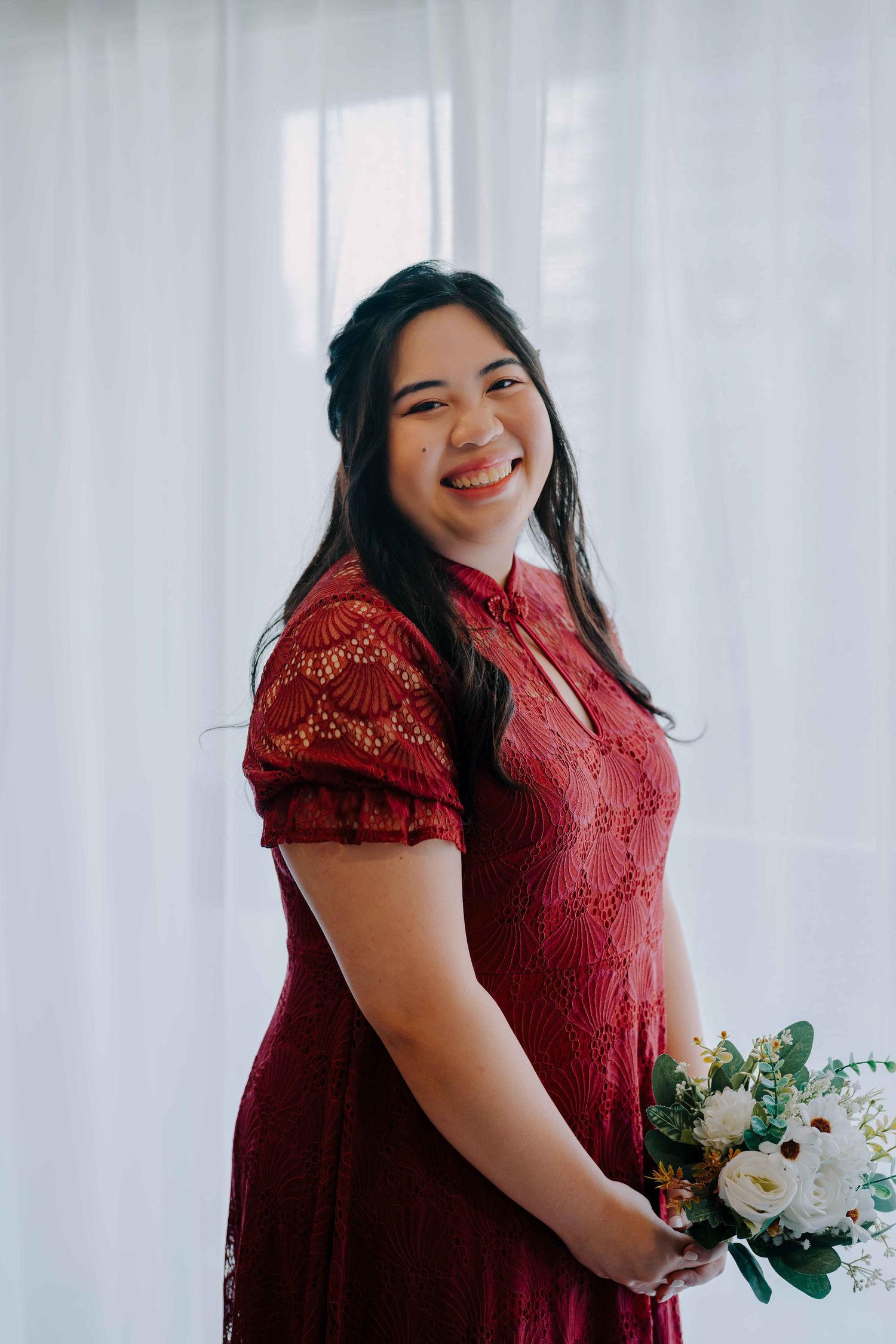 bride in red gown for tea ceremony