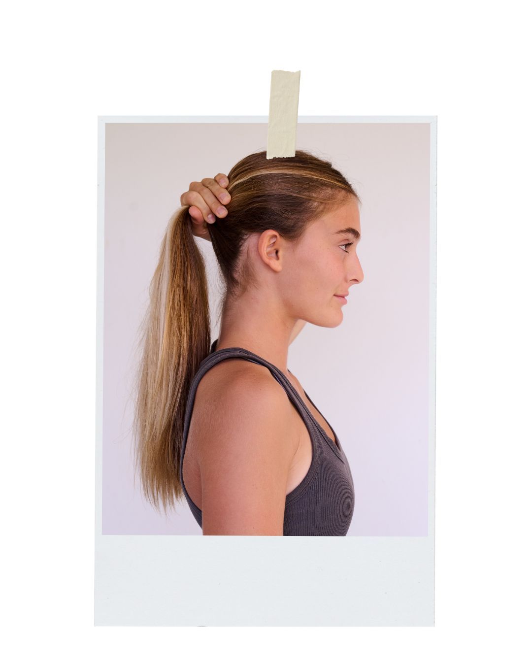 Side profile view of a person with long straight blonde hair pulled back in a ponytail wearing a dark tank top.