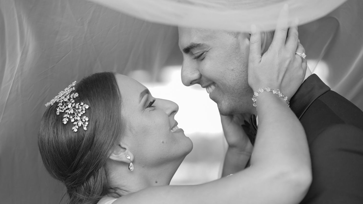 Romantic black and white wedding portraits showing tender moments between newlyweds.