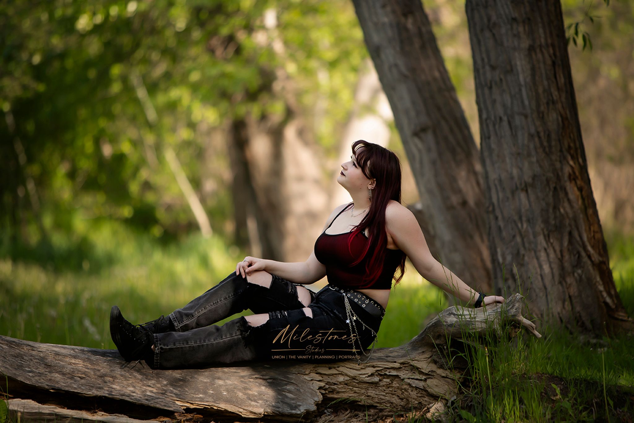 Senior photos Boise River Milestones Studios girl sitting on log