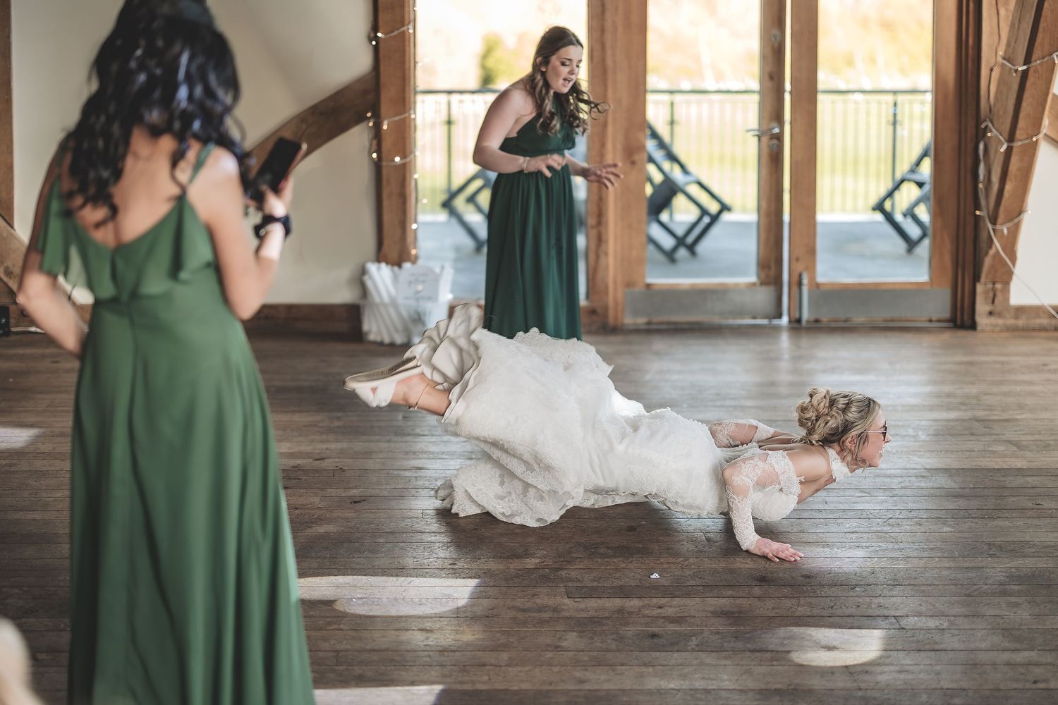 Unplanned wedding moment bride does the worm on the dance floor at sandburn hall.