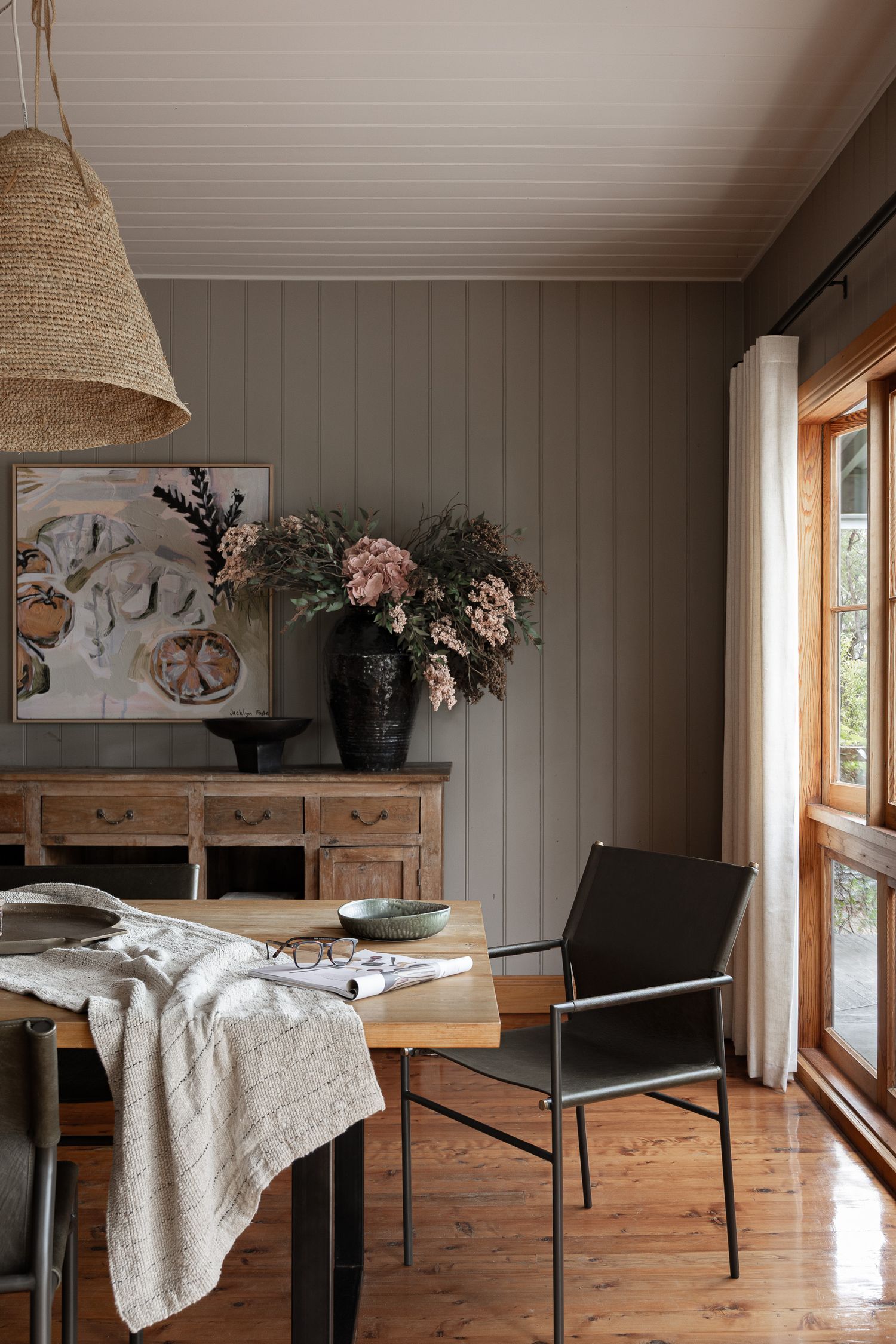 Editorial dining room photography with soft coastal styling in a South Coast NSW holiday home captured in natural light.