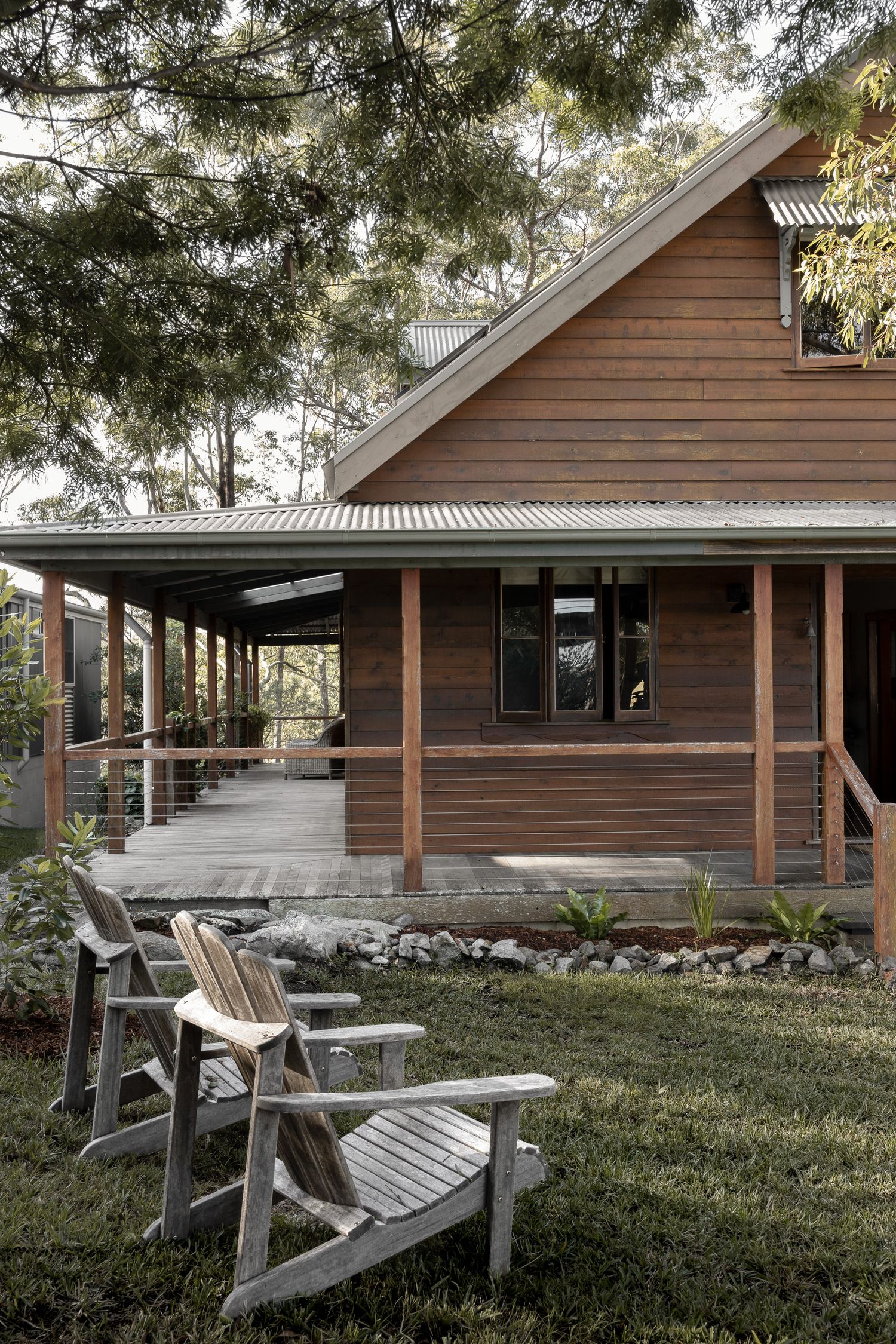 Exterior photography of cedar coastal cottage surrounded by native landscape in Hyams Beach on the NSW South Coast.