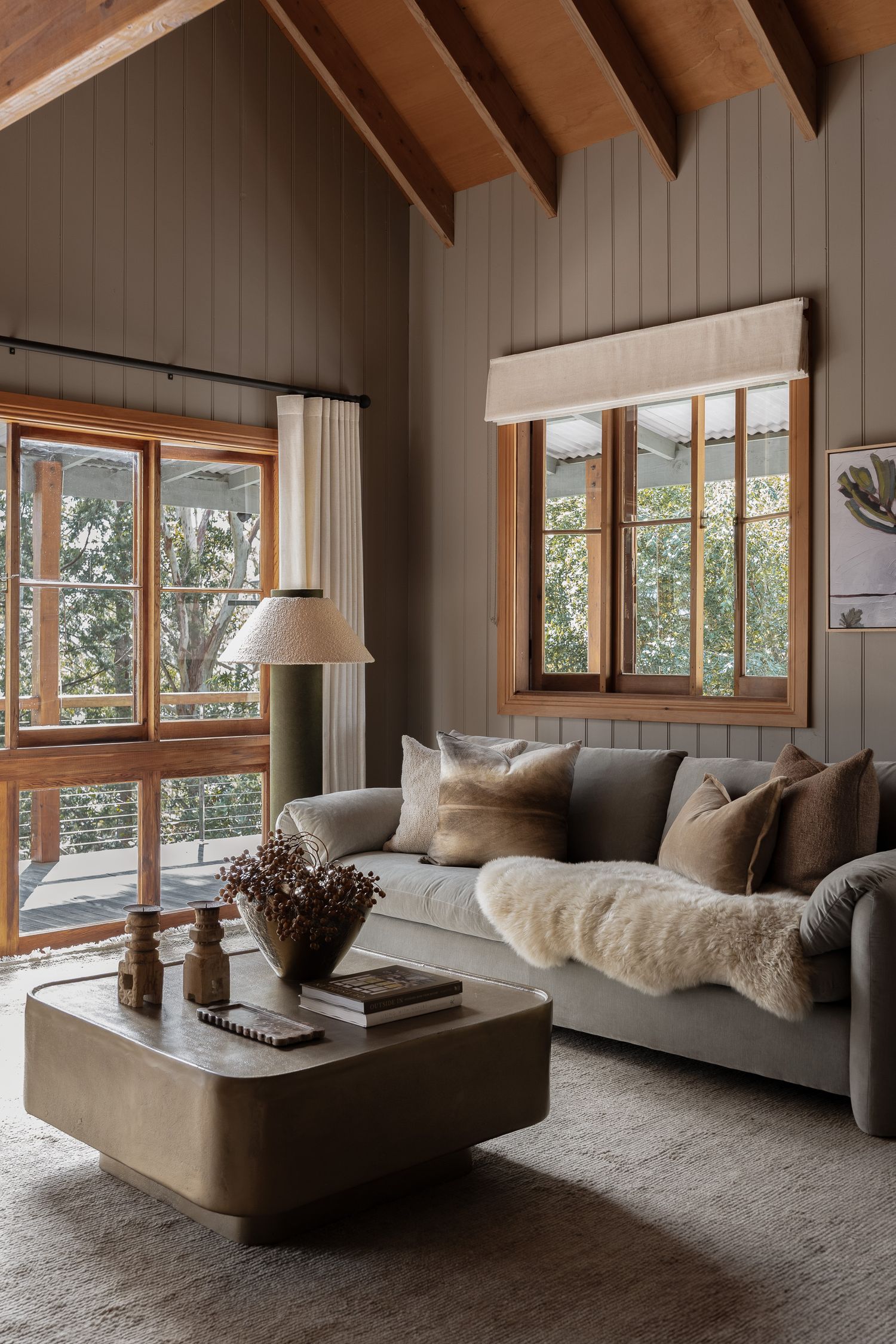 Coastal interior detail photography featuring neutral sofa styling and natural light in a South Coast NSW holiday home.