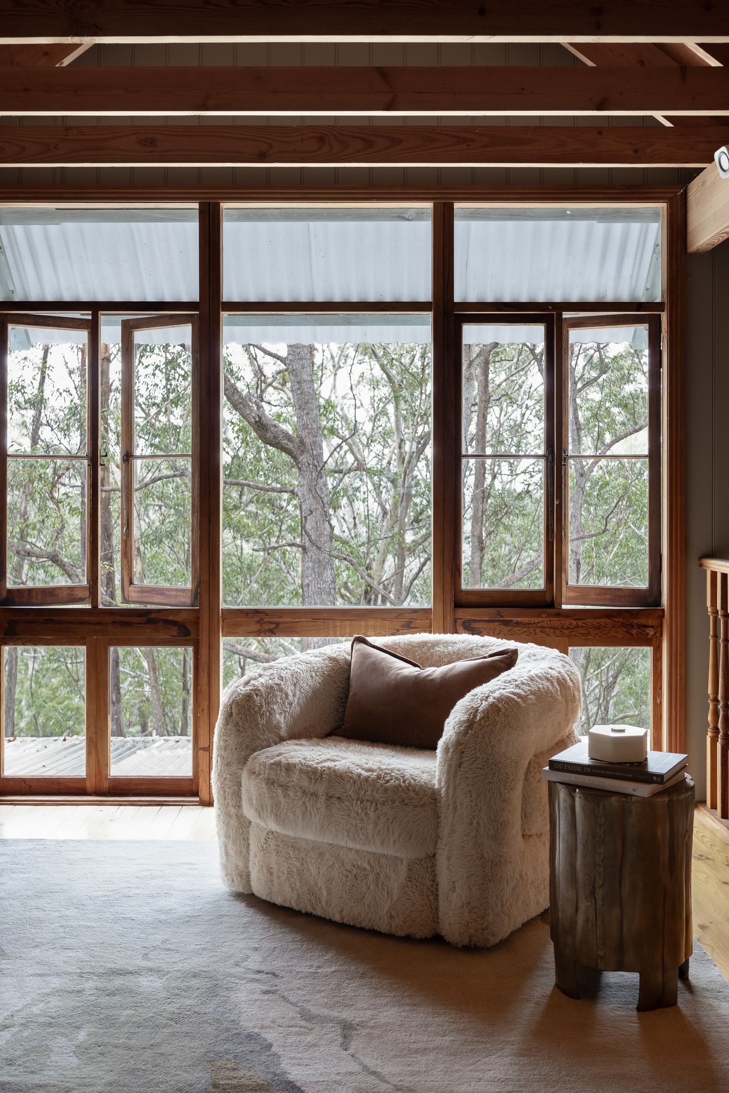 Large timber windows overlooking surrounding nature in a peaceful Hyams Beach coastal home photographed by Life in Still.