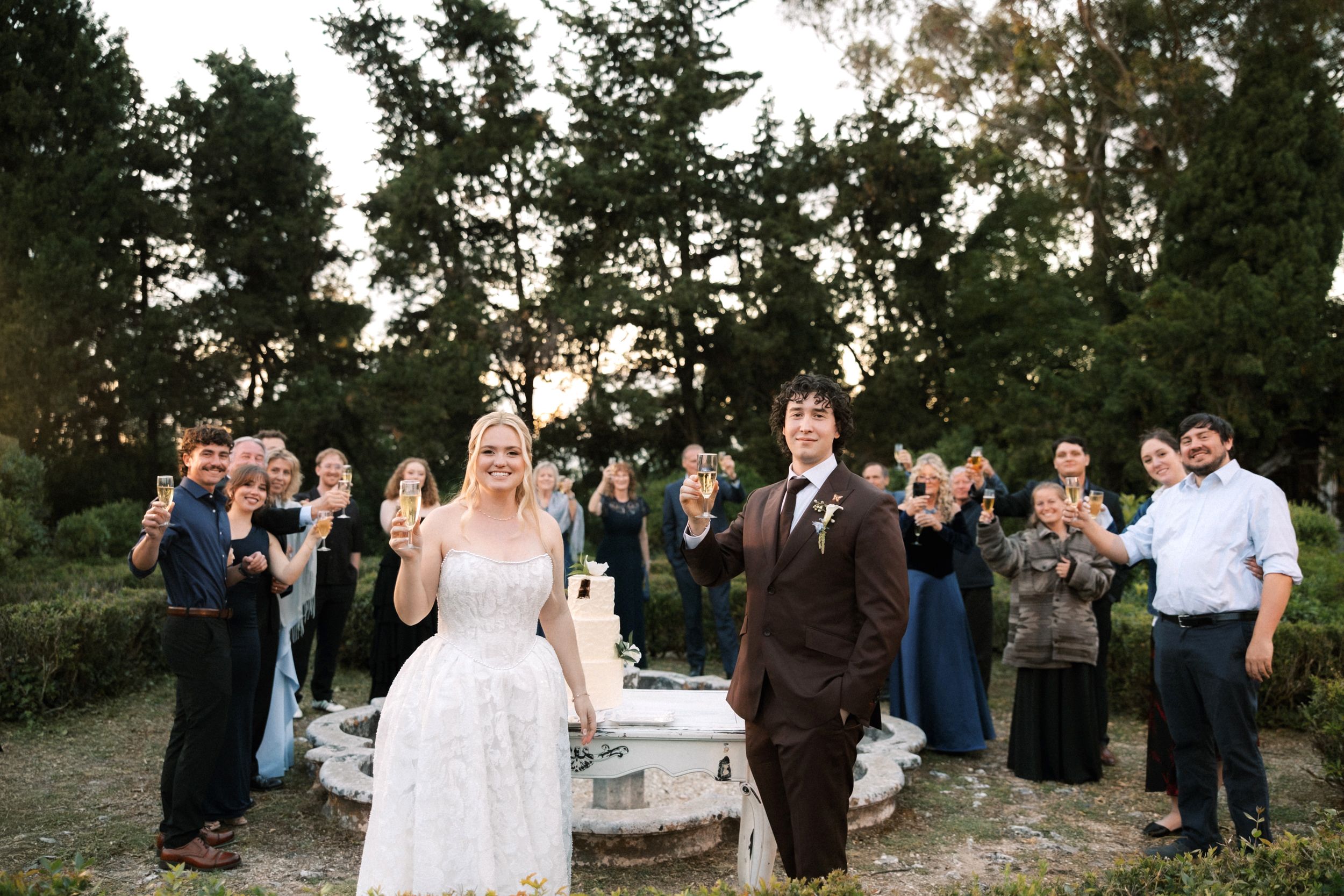 Joyful destination weddinBride and groom celebrating with friends and family in Portugalg celebration in Portugal