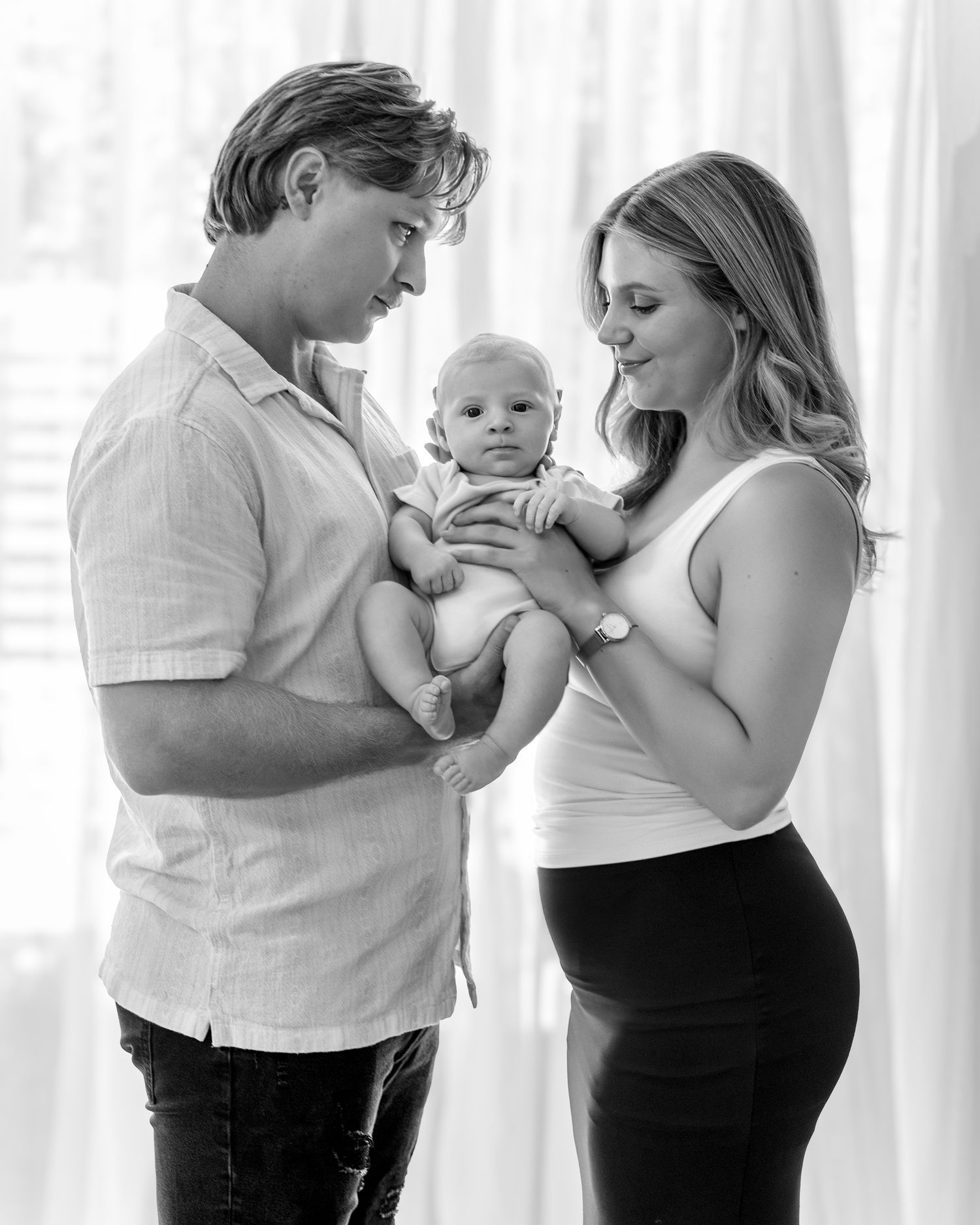 White stretch jersey gown, comfortable and flattering for a studio maternity session