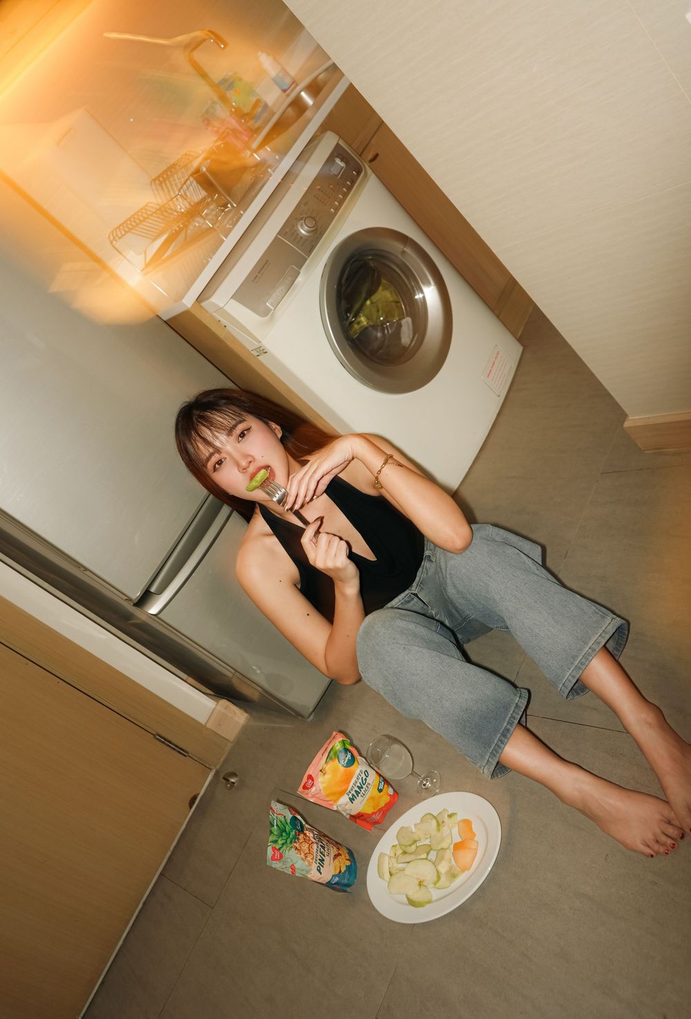 A sequence of photos showing someone preparing and enjoying a meal in a home kitchen setting.