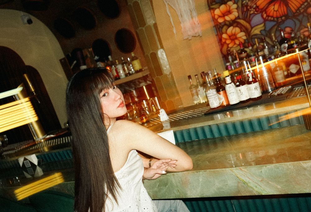 A collection of candid bar scene photos showing drinks, glassware and warm lighting in a casual establishment.