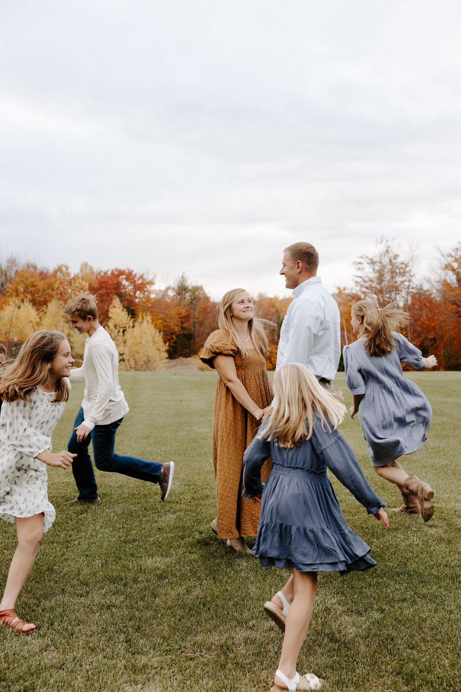 Family photoshoot outside in a field by Local Roots Photography.