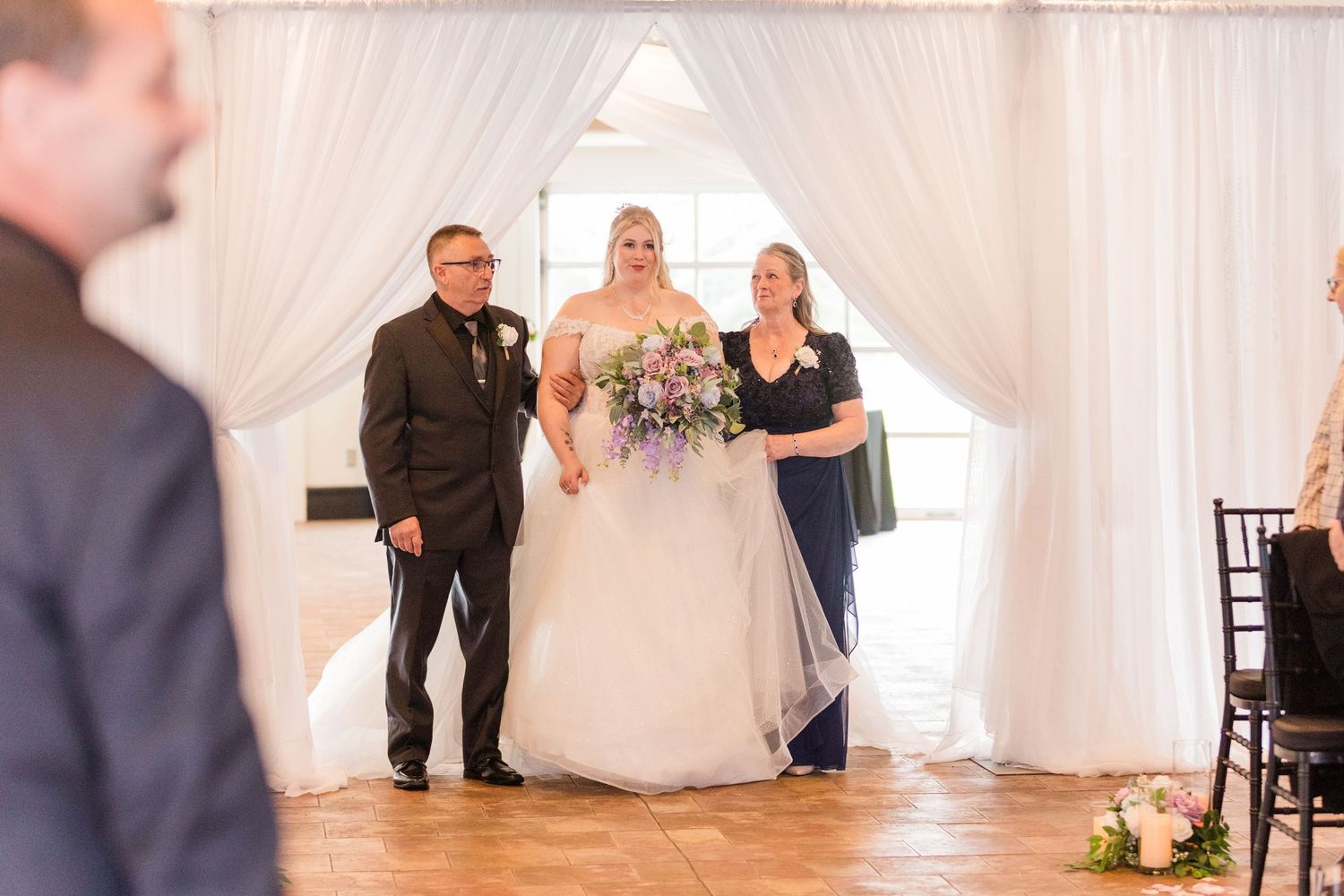 A wedding ceremony sequence showing multiple angles of a couple getting married in an elegant white-draped venue.