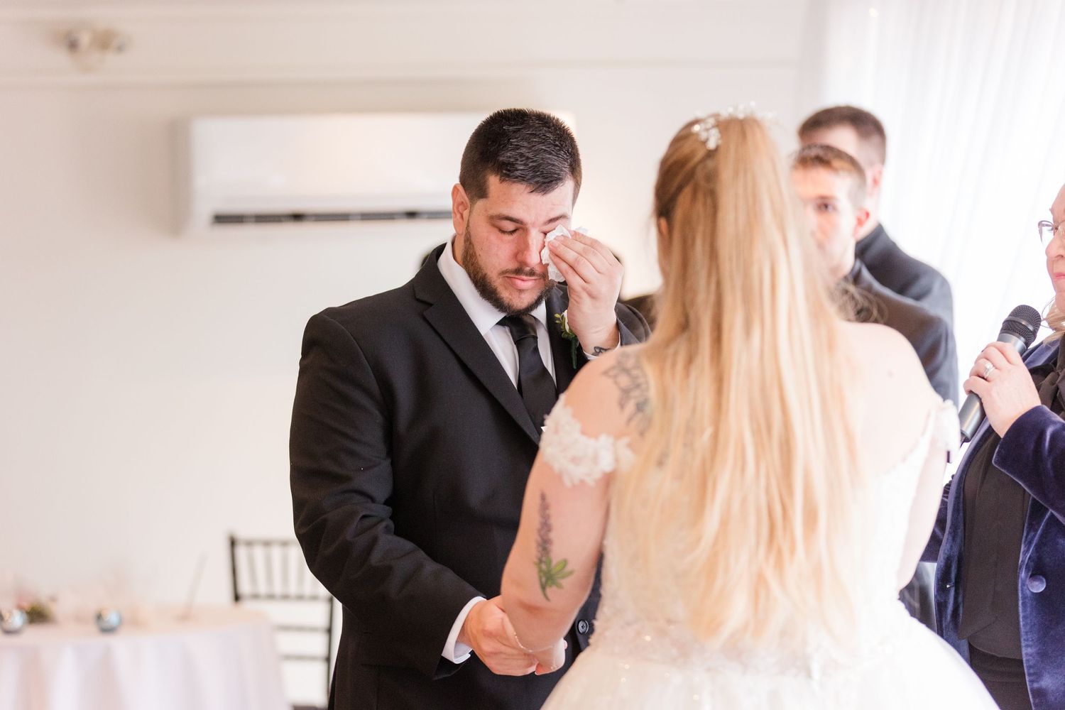 A sequence of wedding photos showing tender moments between a couple during their ceremony.