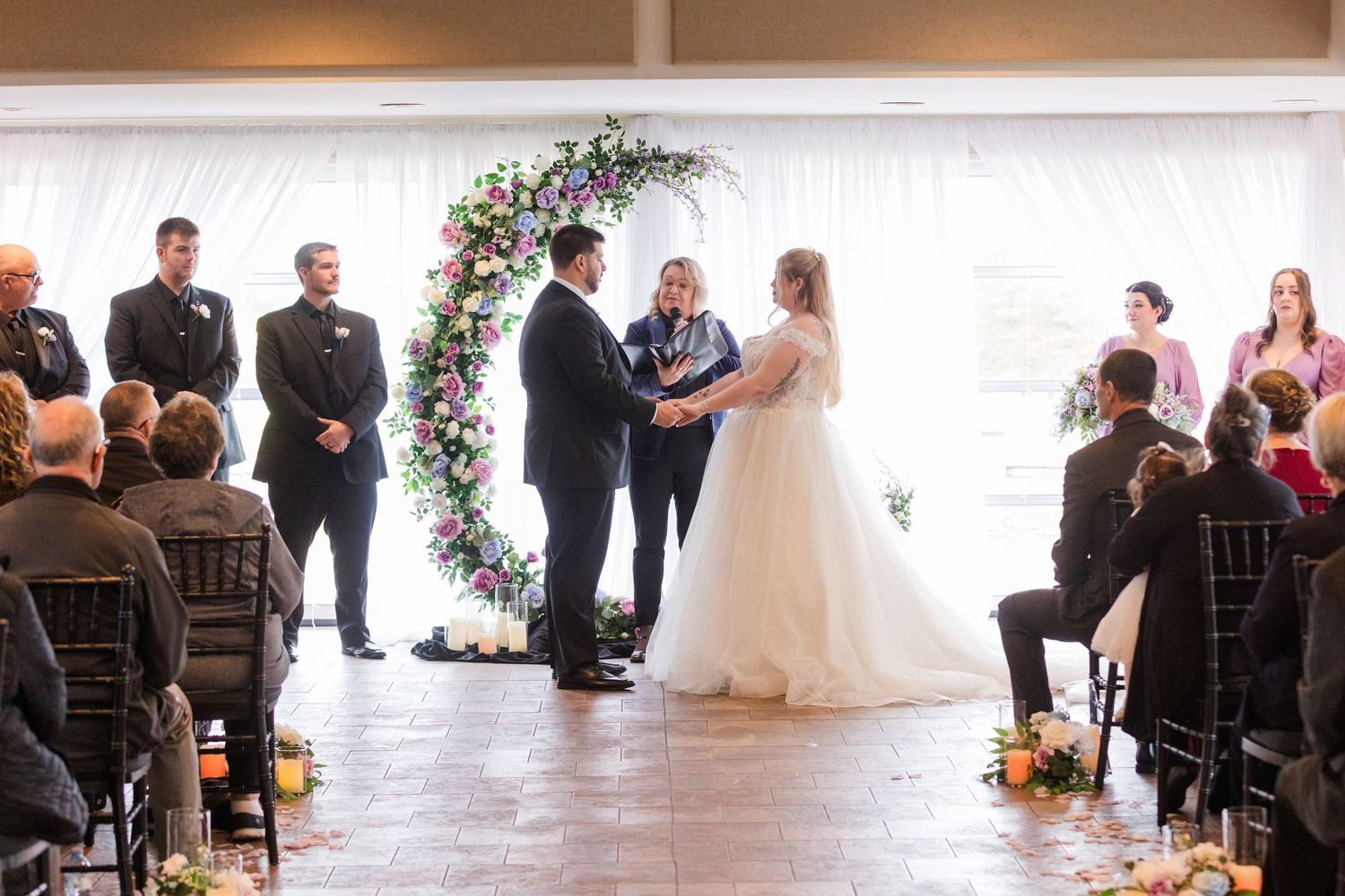 Wedding ceremony montage showing multiple angles of a romantic indoor celebration with floral decorations.