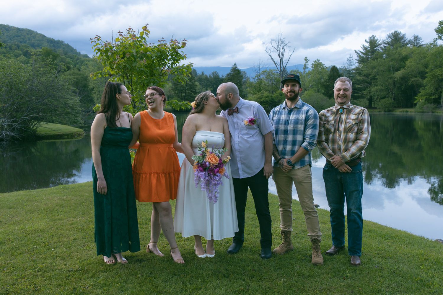 small wedding ceremony in black mountain wnc group photo on a lake with mountains