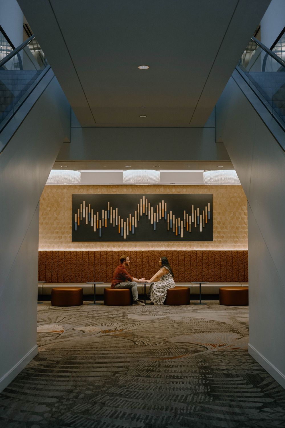 Modern architectural space with brick walls and geometric lighting patterns.