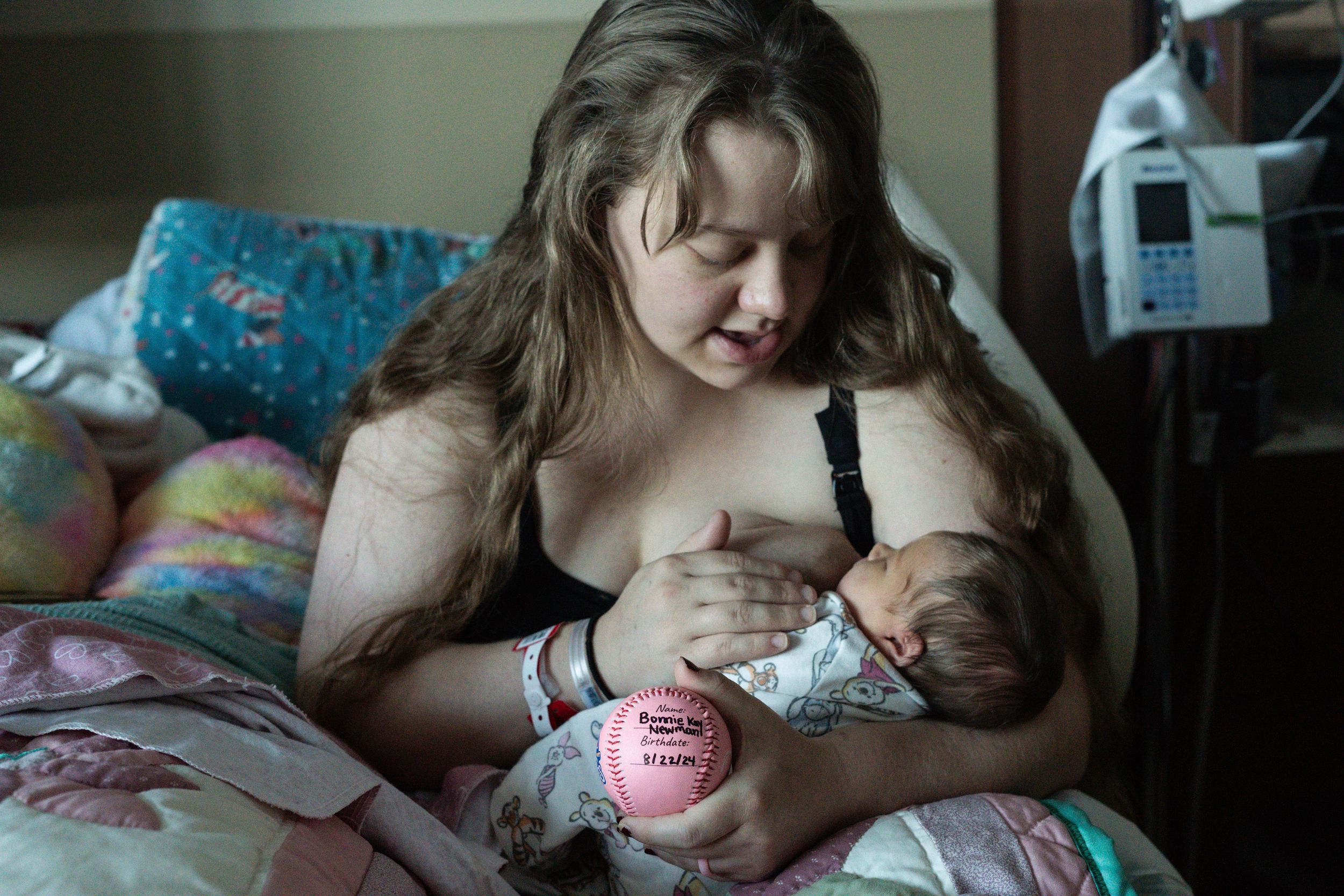 A peaceful scene of bonding with a newborn in a hospital environment.