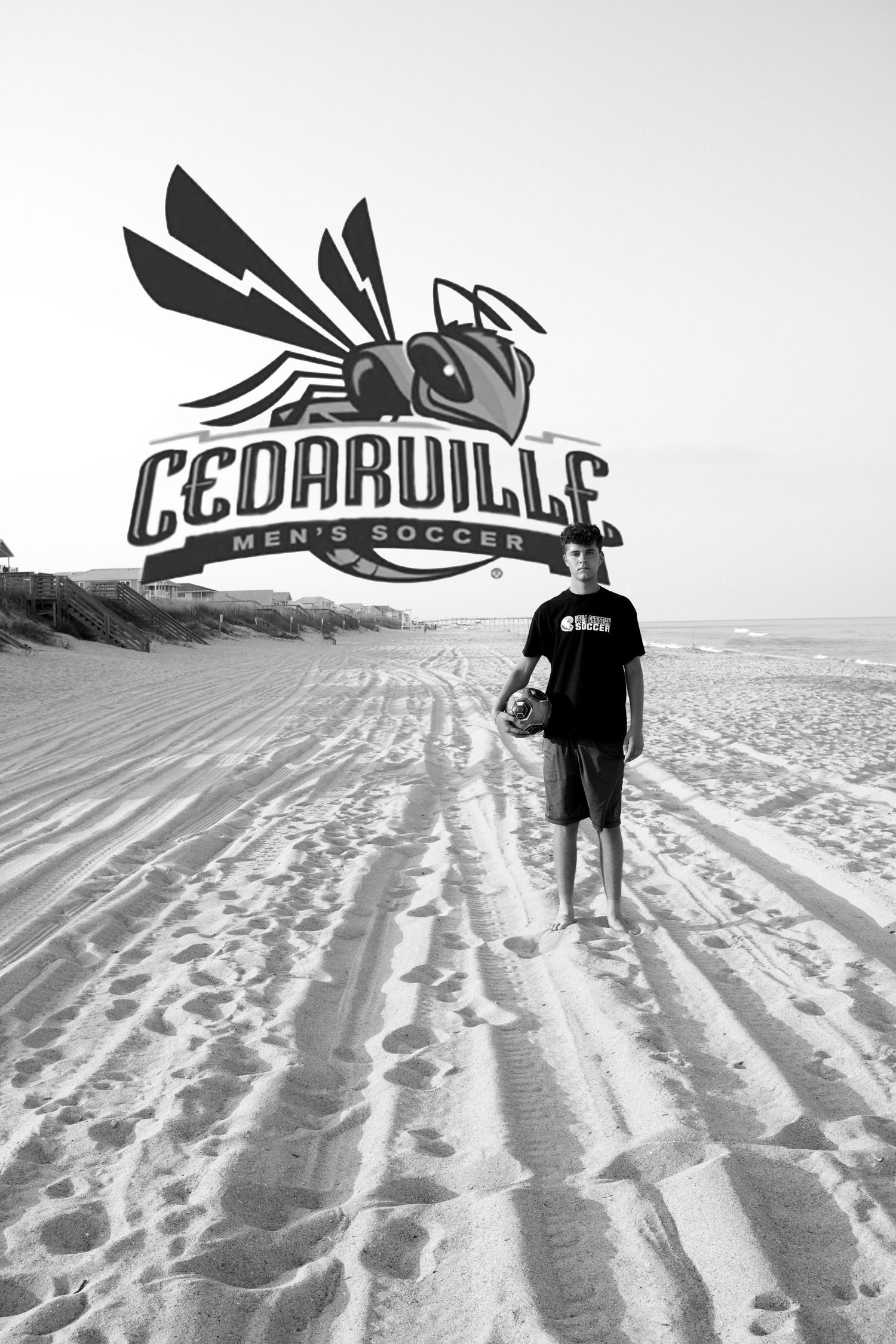 Soccer player walking on beach with Cedarville logo overlay in black and white.