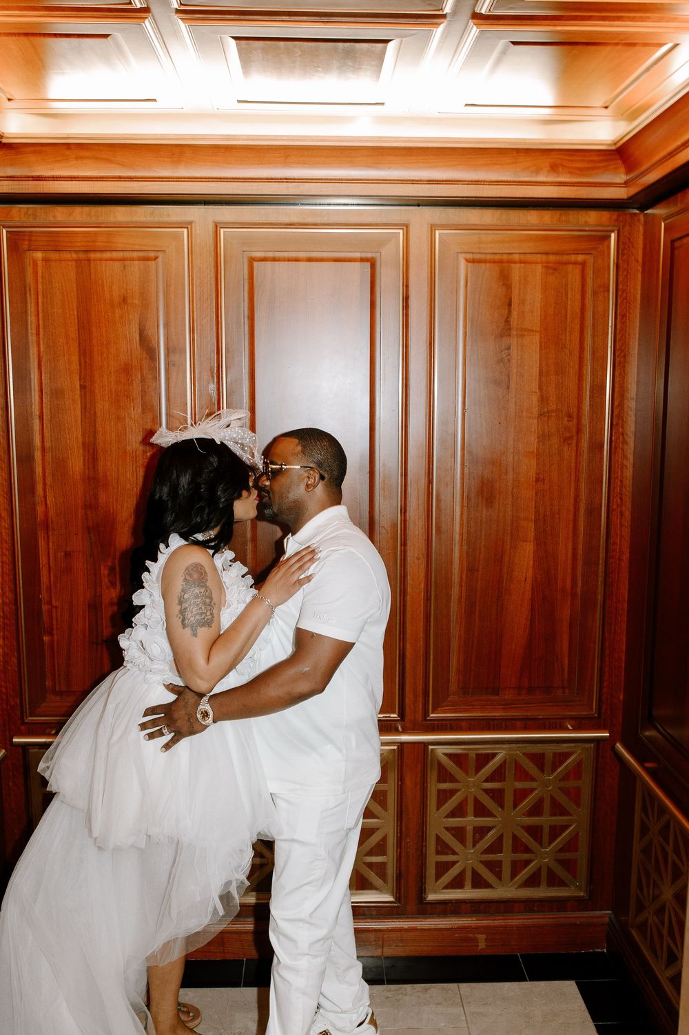 A romantic sequence of three wedding photos showing a couple dipping and kissing in an elegant wood-paneled room.