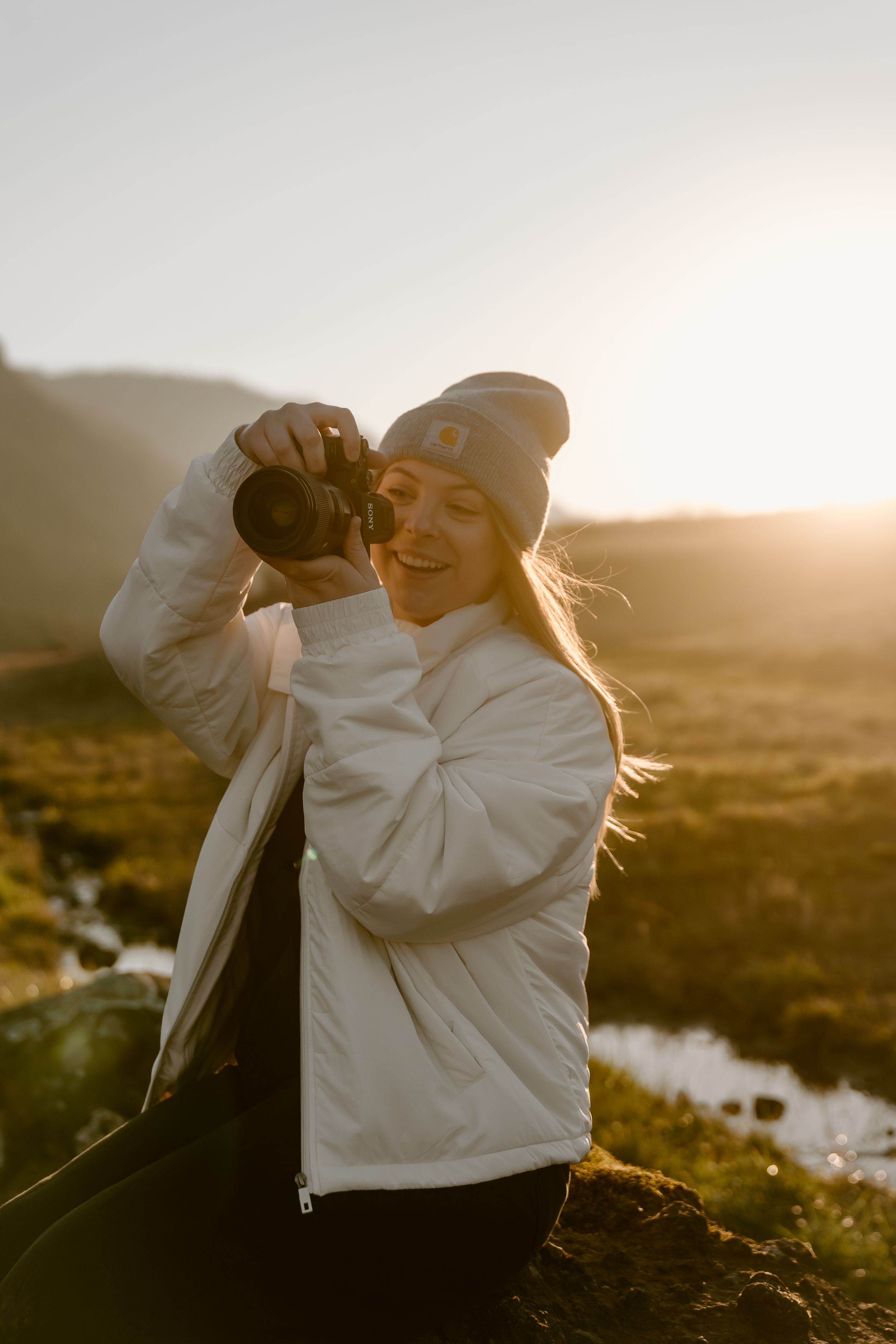 Black and white portraits of photographer at work in outdoor setting.