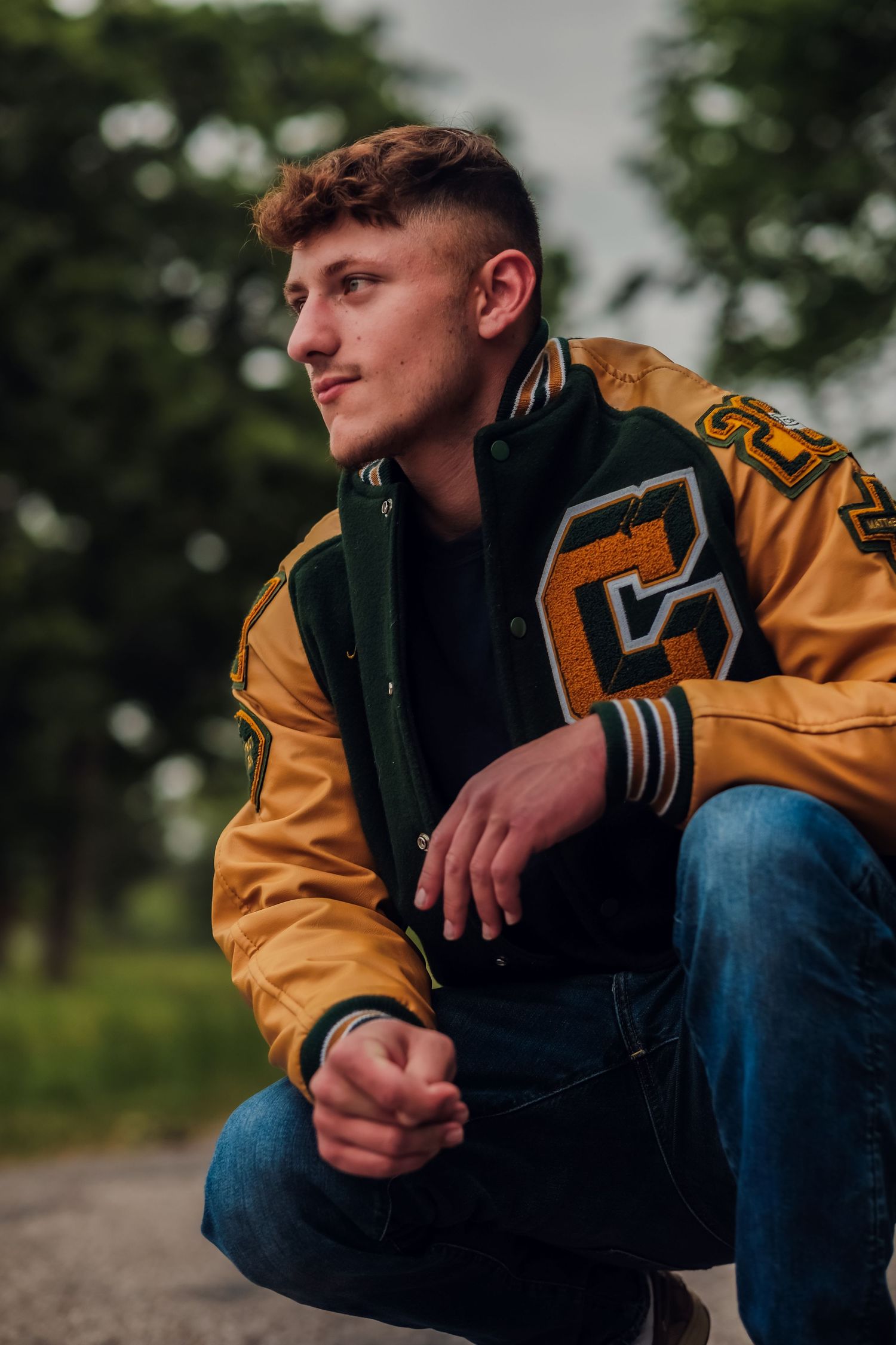 boy wearing letterman jacket outdoors senior photo Lafayette