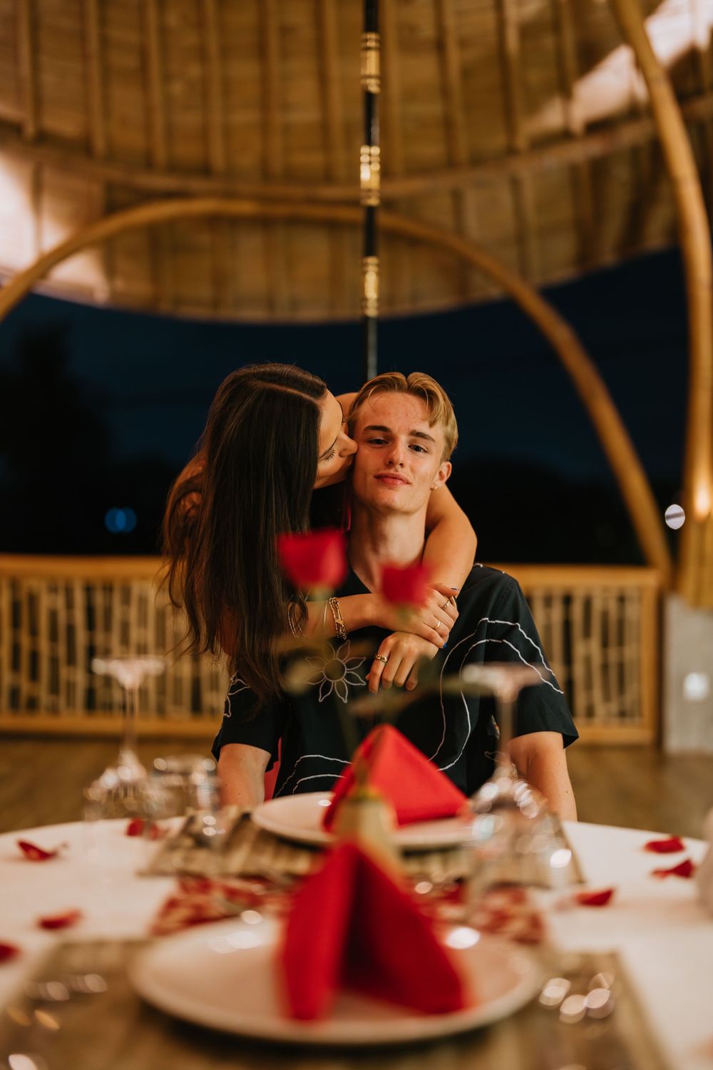 Romantic dinner couple photoshoot in Bali with candlelight and elegant setup