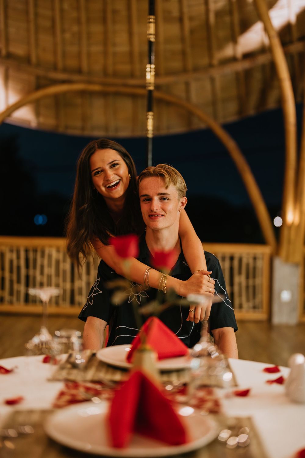 Romantic dinner couple photoshoot in Bali with candlelight and elegant setup