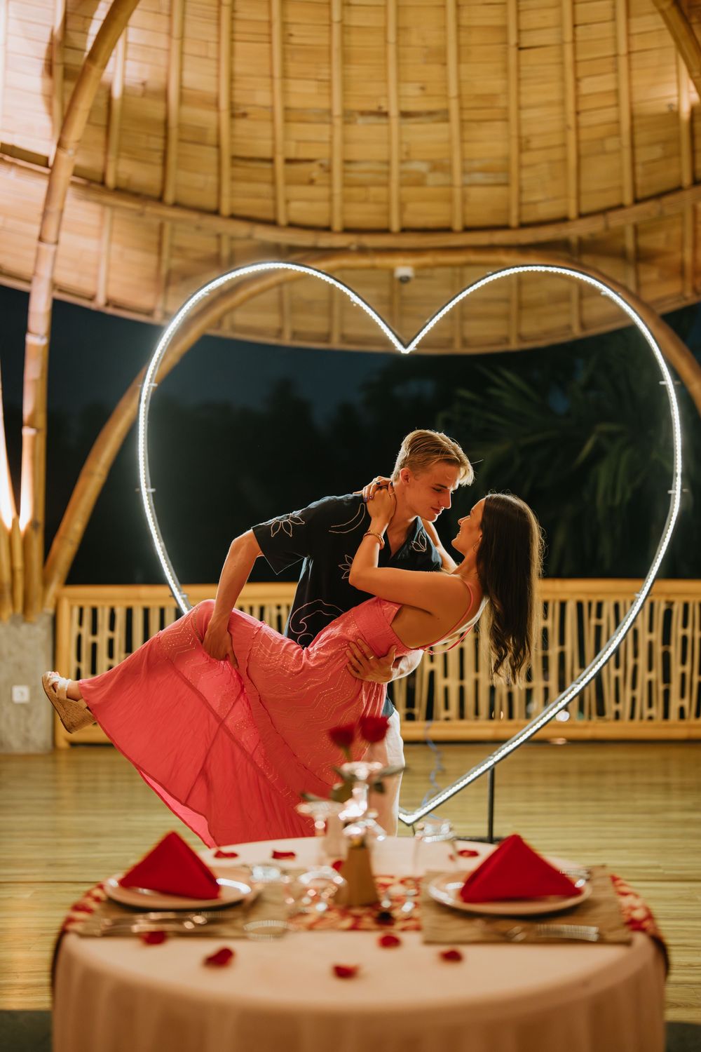 Romantic dinner couple photoshoot in Bali with candlelight and elegant setup