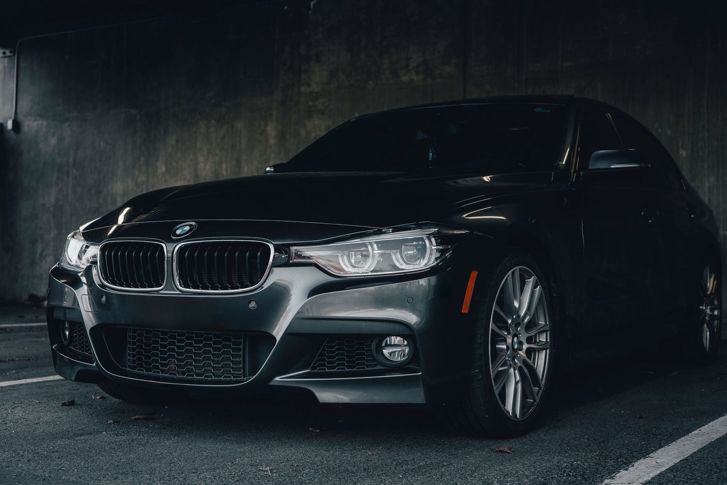 Cinematic nighttime automotive photography with dramatic lighting and modern commercial style.