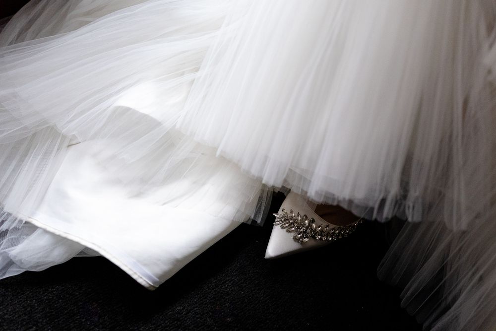 Abstract white tulle fabric creates flowing layers and soft textures in a monochromatic artistic composition.