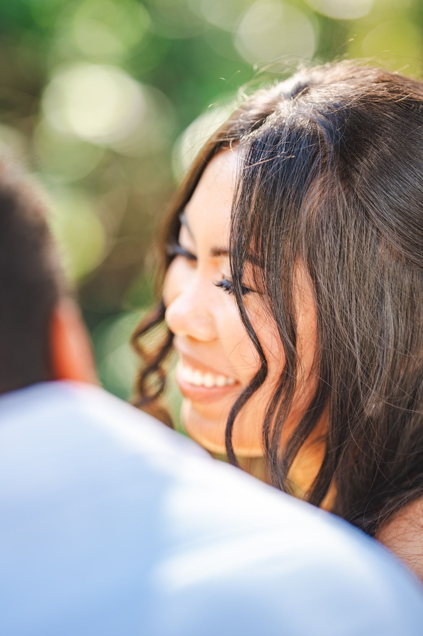 Close up portrait of Bride, smiling with groom on wedding day in botanical Gardens Gibraltar
