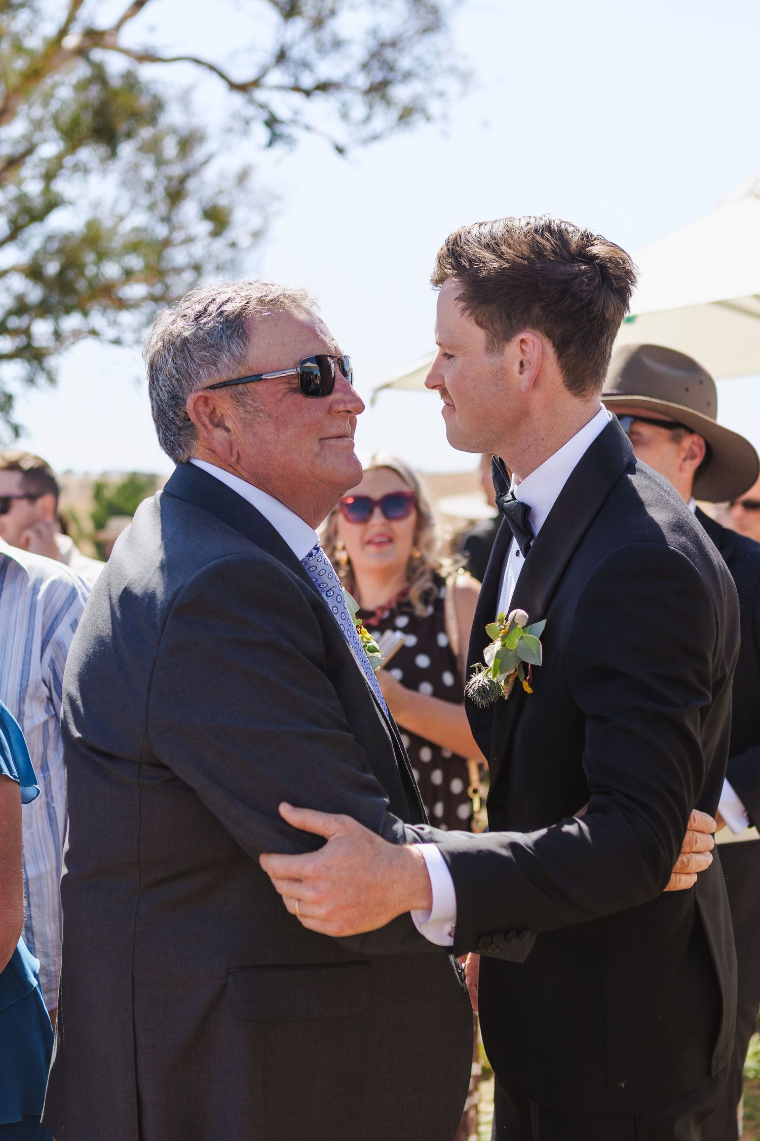 Groom hugging father of the groom after ceremony at country NSW wedding