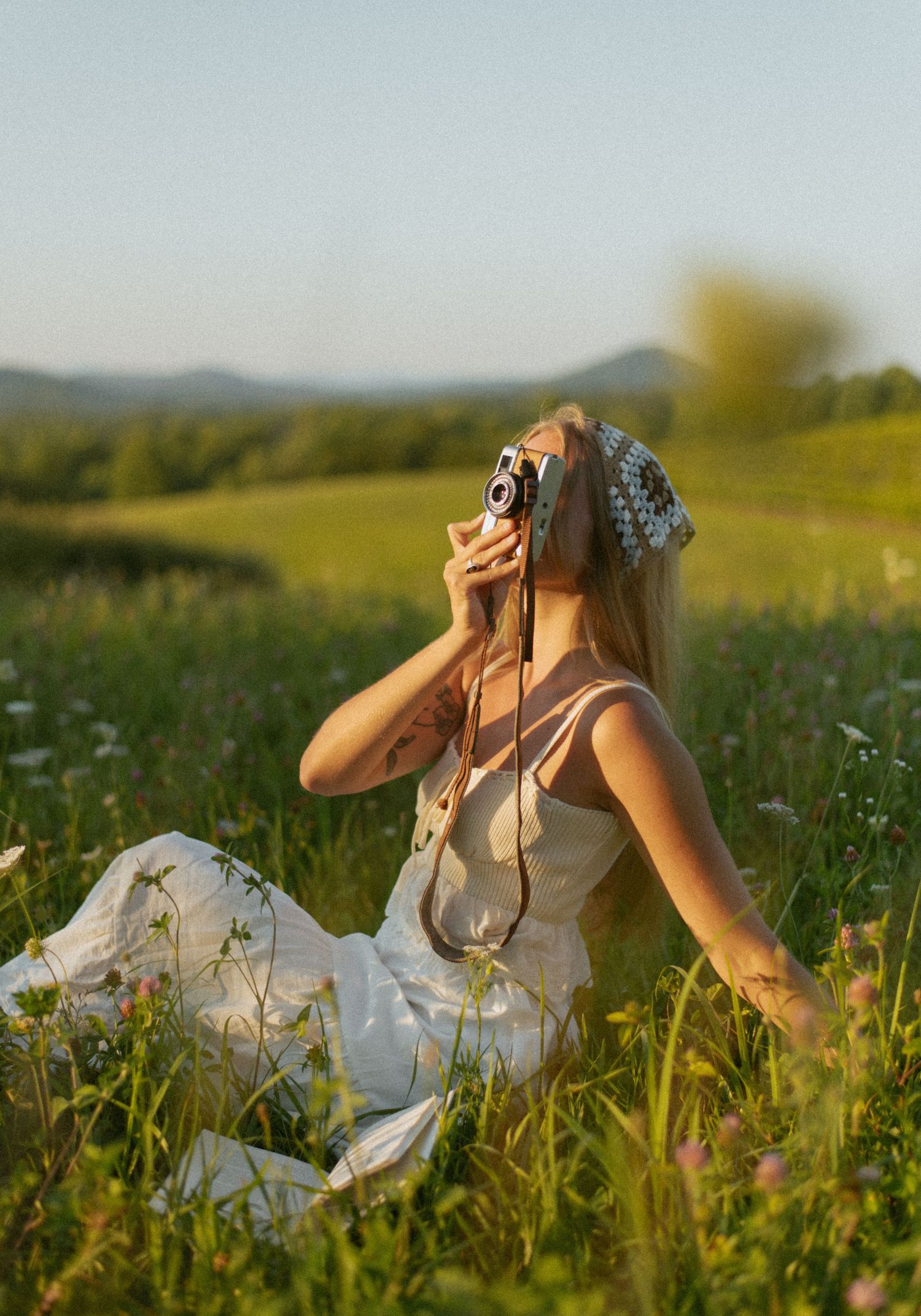 A person in a black tank top holds a small gray and white cat while smiling at the camera in a photo series.