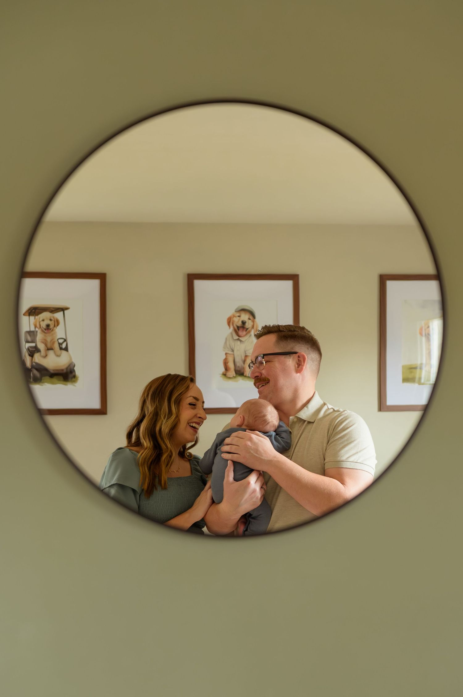 A series of oval mirror reflections showing a couple playing with their dog in a warm-toned interior setting.