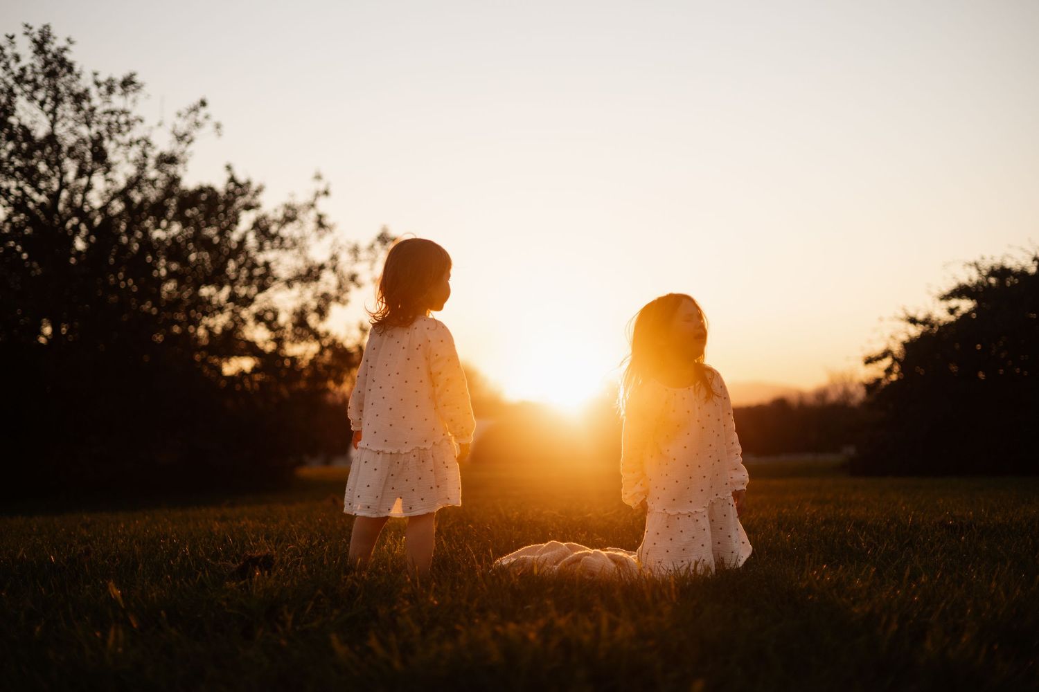 sisters admiring the view at sunset at Roto Kohatu Reserve Christchurch