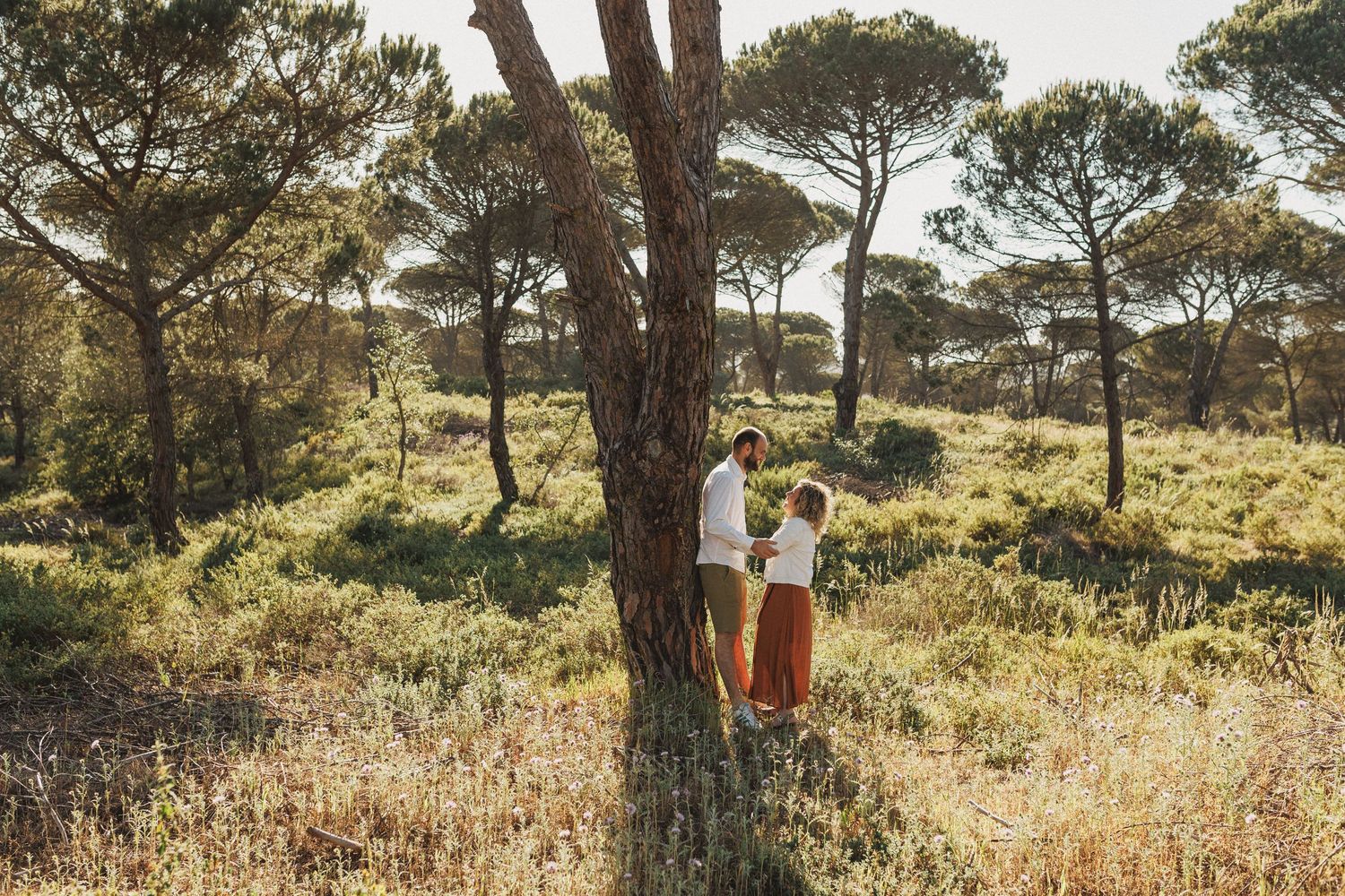 Close intimate moment of couple smiling during engagement photoshoot in Portugal nature