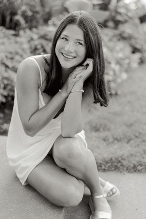 Black and white photo series capturing relaxed poses on a stone surface outdoors.