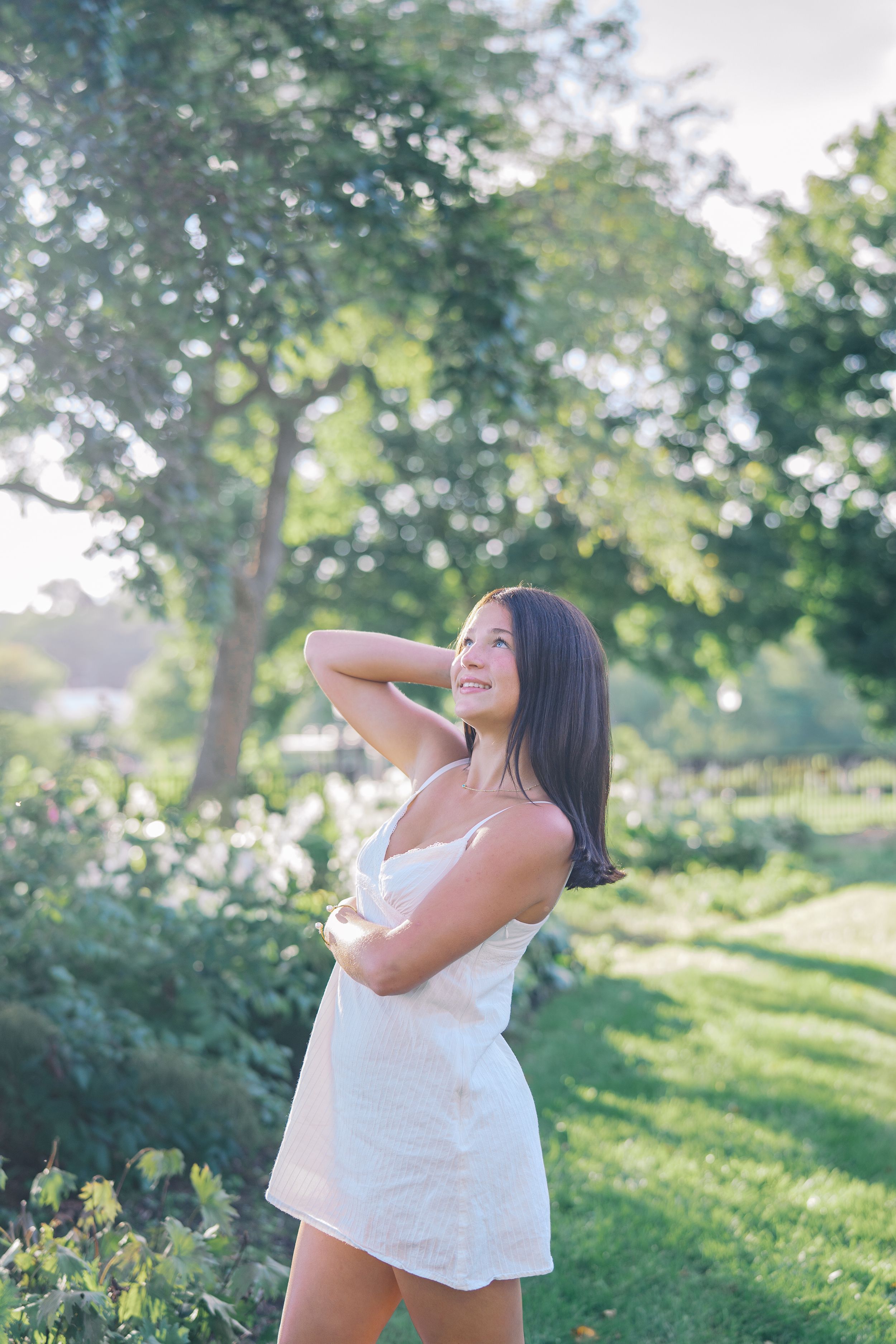 Joyful outdoor photos captured in golden afternoon light among garden greenery.