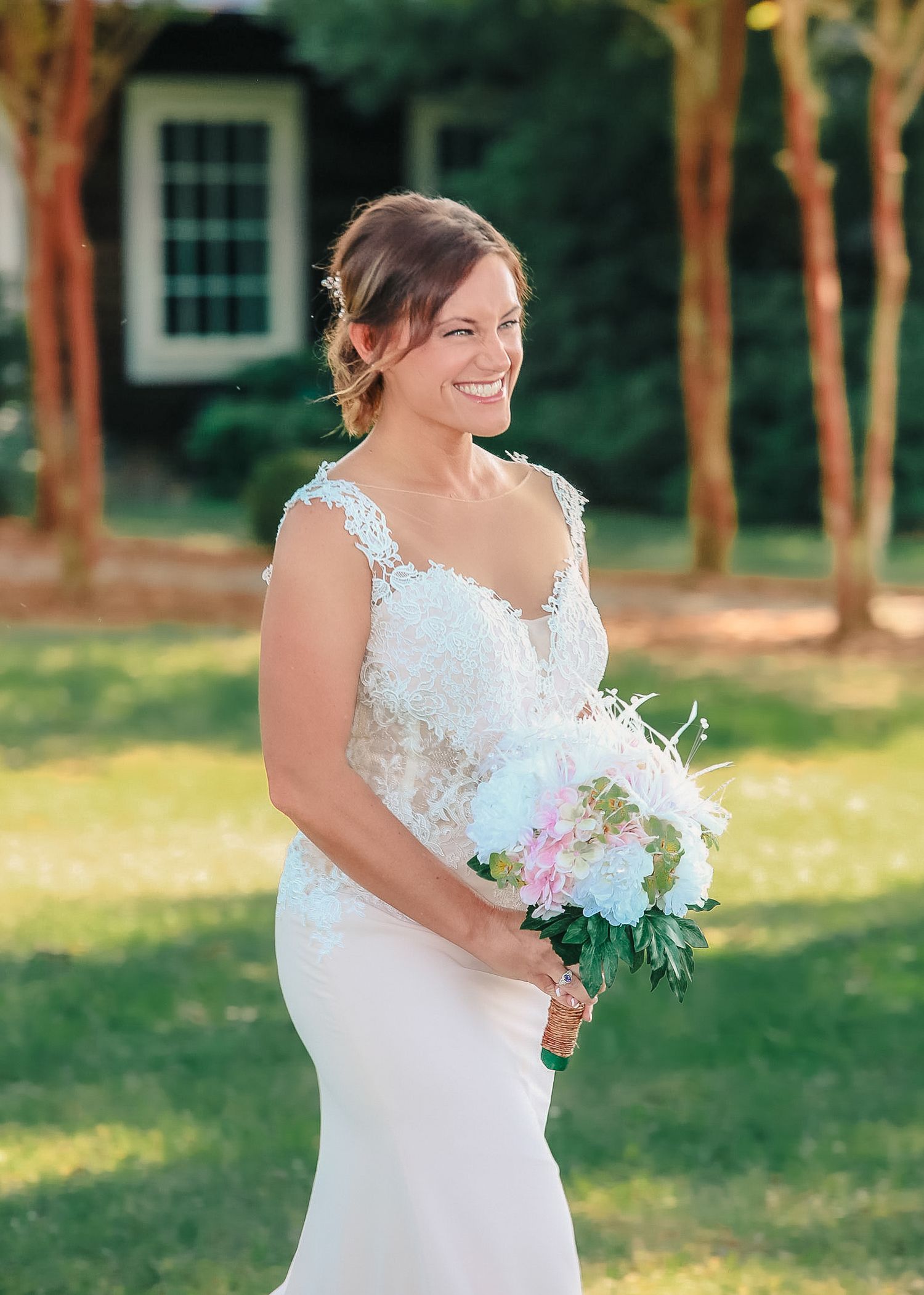 Bride holding bouquet walking toward altar at outdoor wedding, photo taken by local photographer Tasha Cannaday, Amherstburg Ontario.