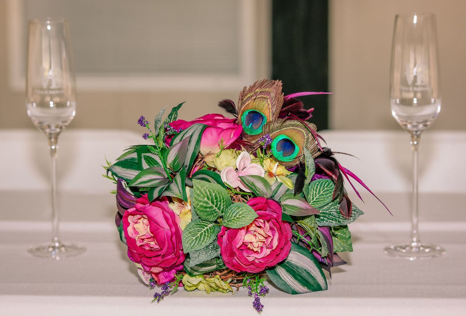 Flower bouquet, champagne glasses, and weeding in a photo taken in Amherstburg Ontario.