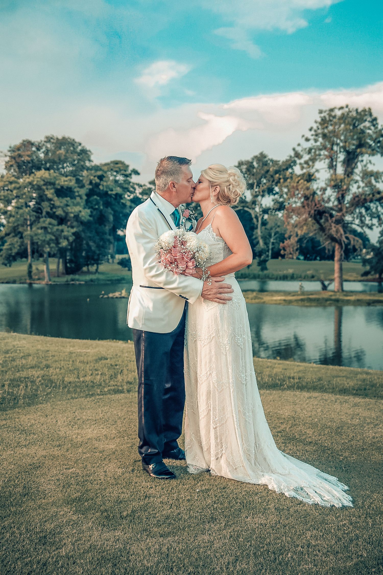 Couple embraces after renewing vows outdoors, photo taken by Tasha Cannaday in Amherstburg.