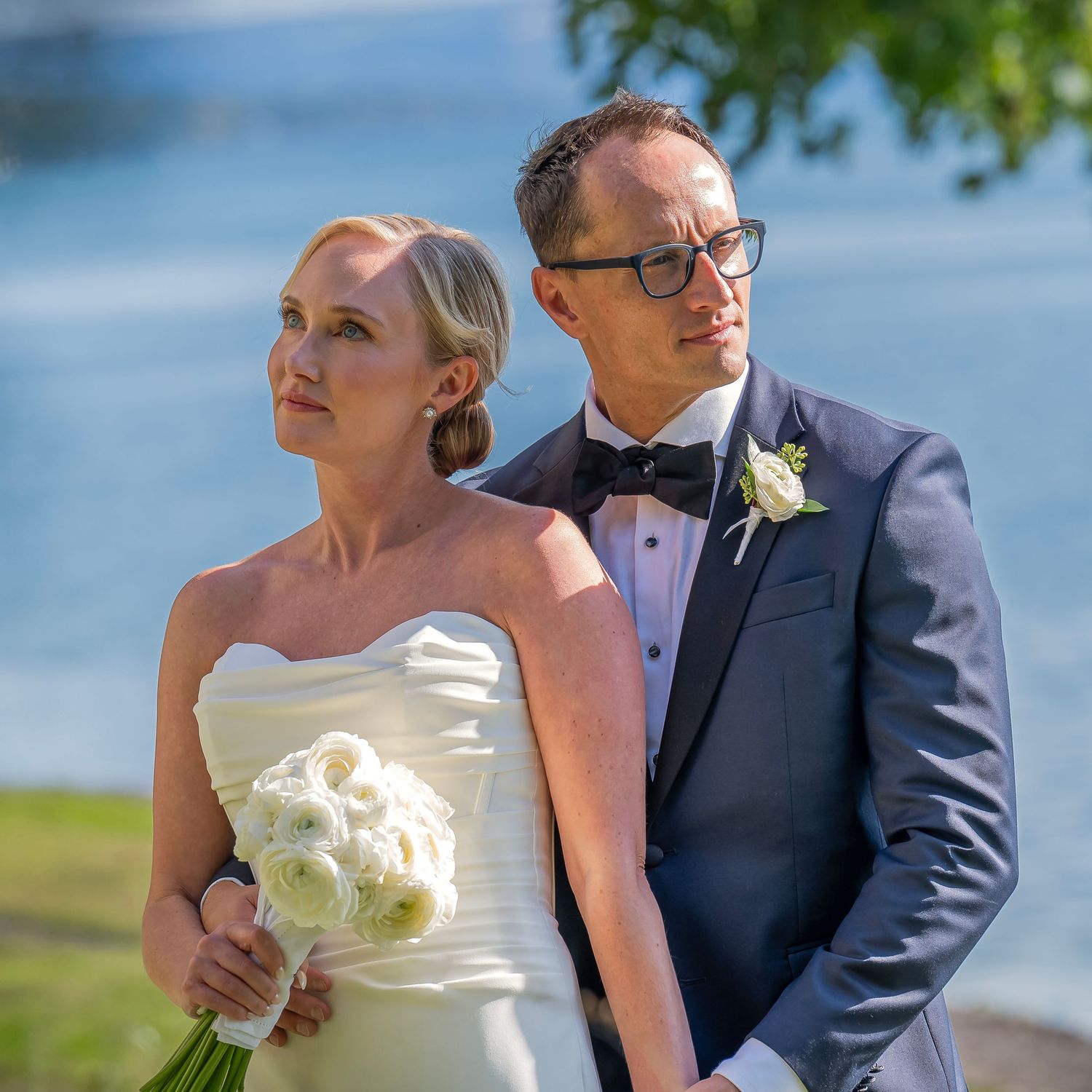 Skaneateles Lake, in the Finger Lakes, is the beautiful backdrop for this couple's stunning outdoor wedding portrait by CNY Photography.