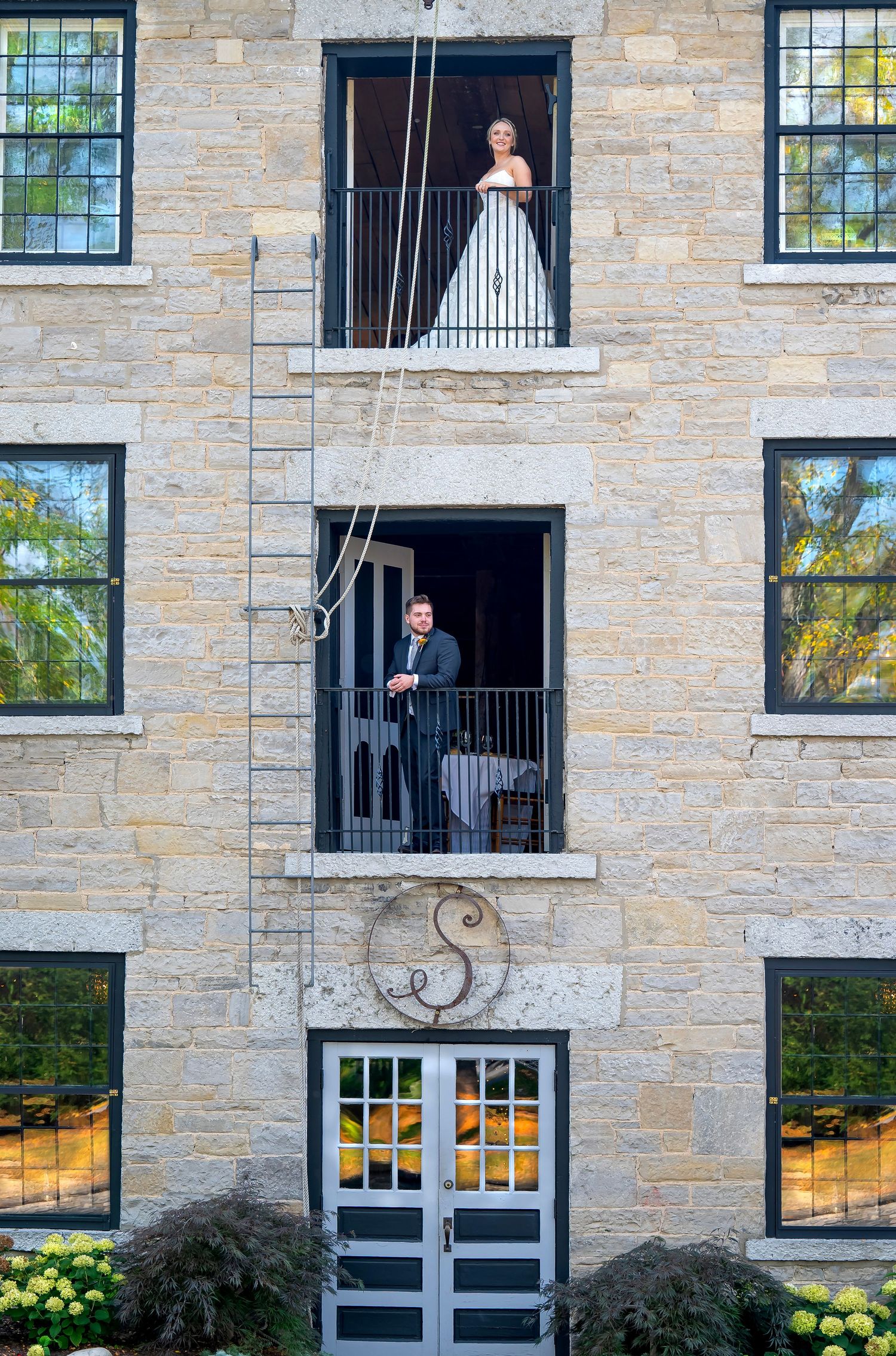 Bride and Grooms first look while separated on balconies above and below each other, The Sinclair, Skaneateles, NY, by CNY Photography.