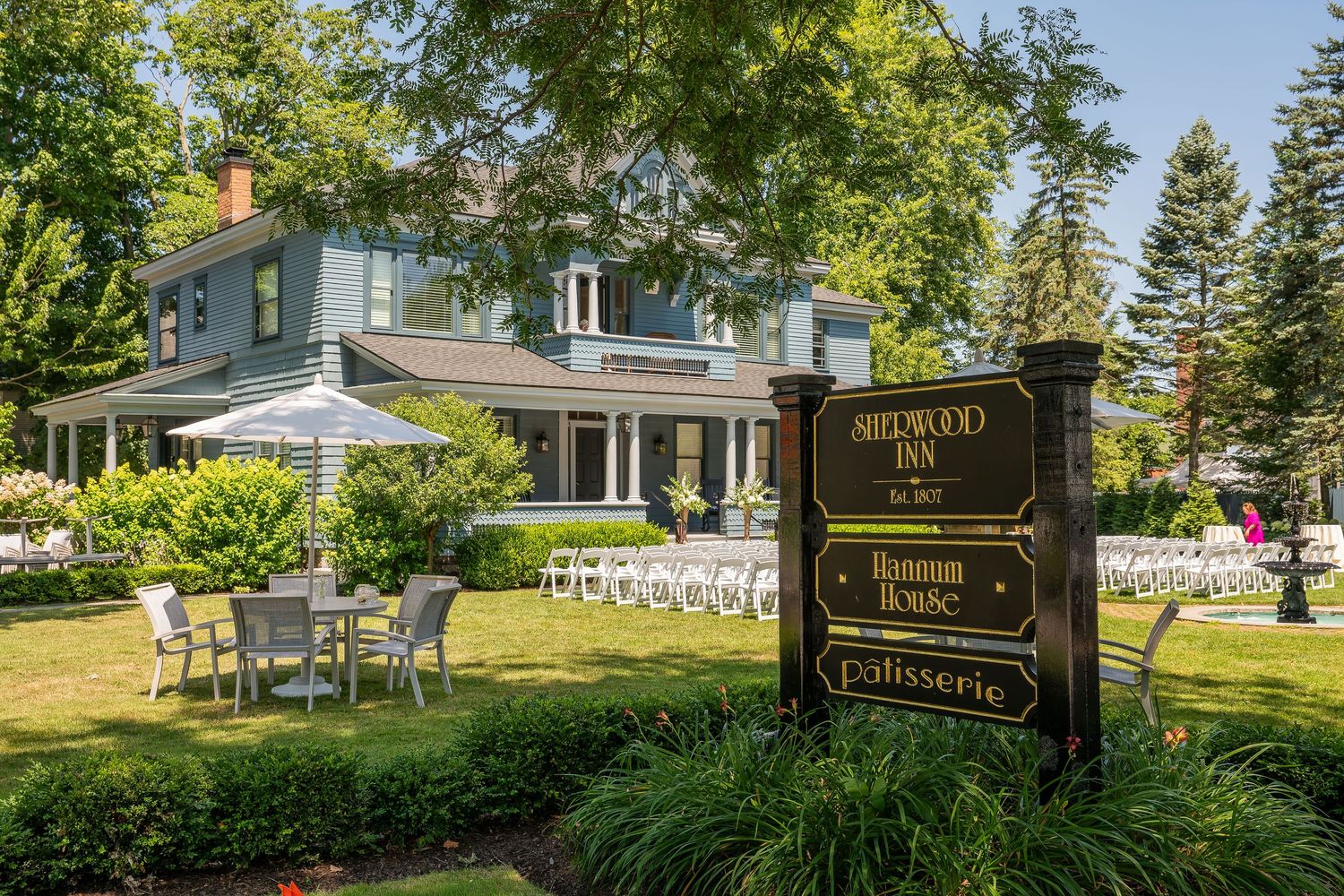 Charming outdoor wedding reception setup on the front lawn of Hannum House, Colonial Revival-style, Sherwood Inn, Skaneateles NY