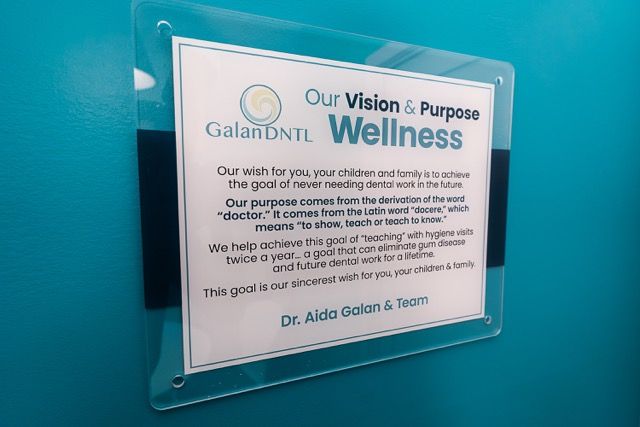 GalanDNTL dental office vision and purpose wellness sign displayed on wall by Dr. Aida Galan and team.